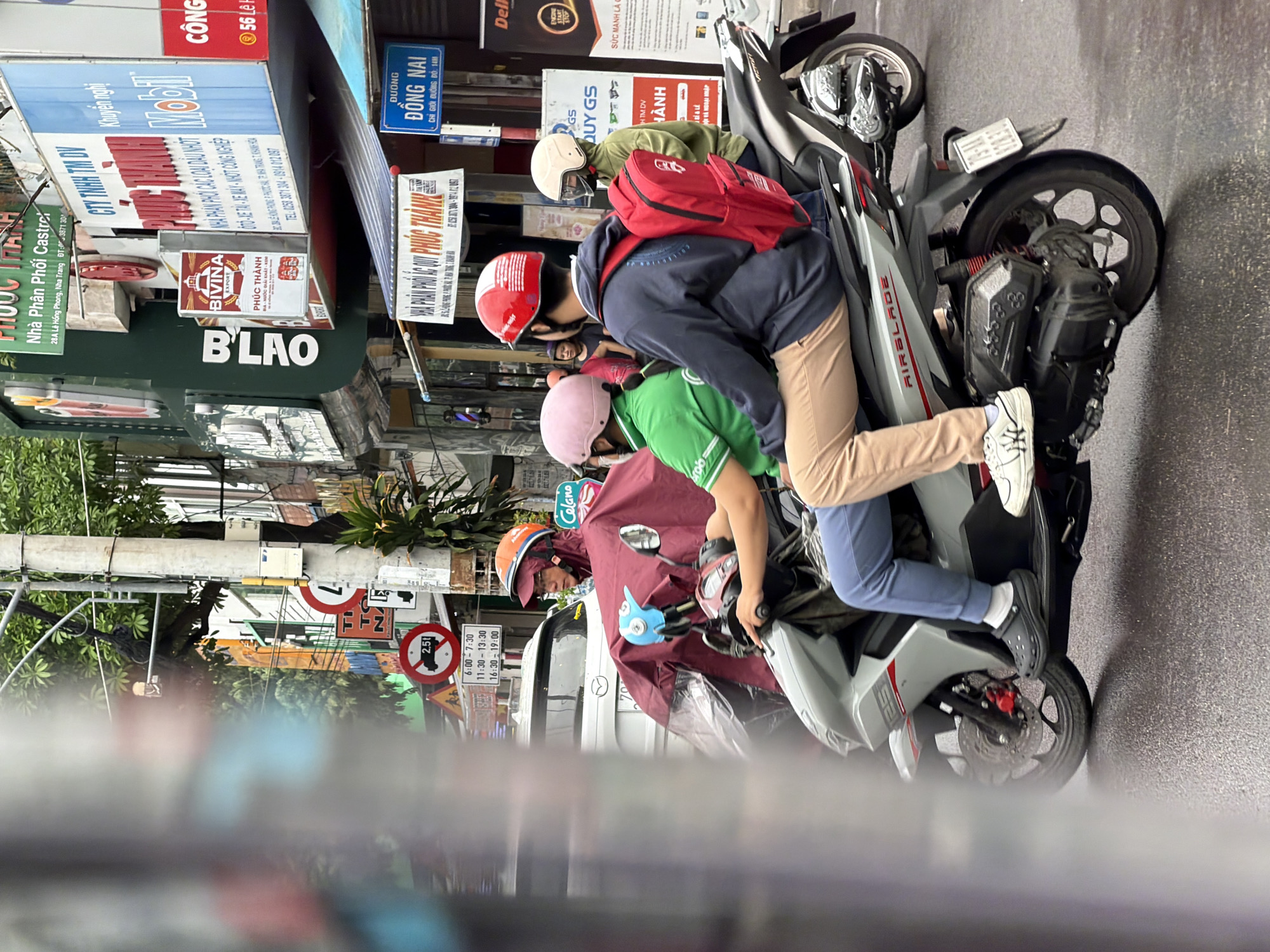 Wet morning street life in Nha Trang, Vietnam