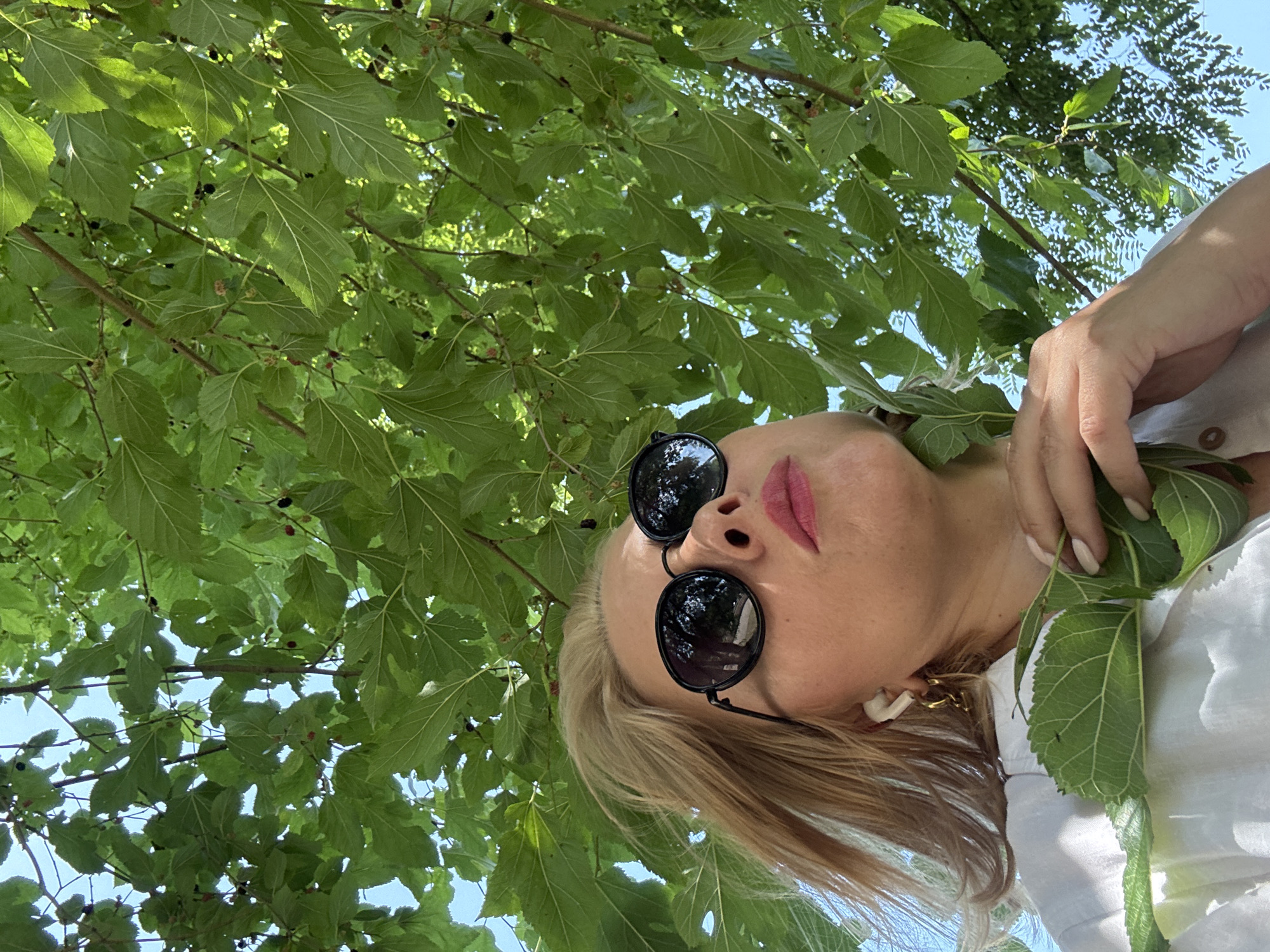 A Sochi park morning: scooters, greenery, and casual outdoor activity