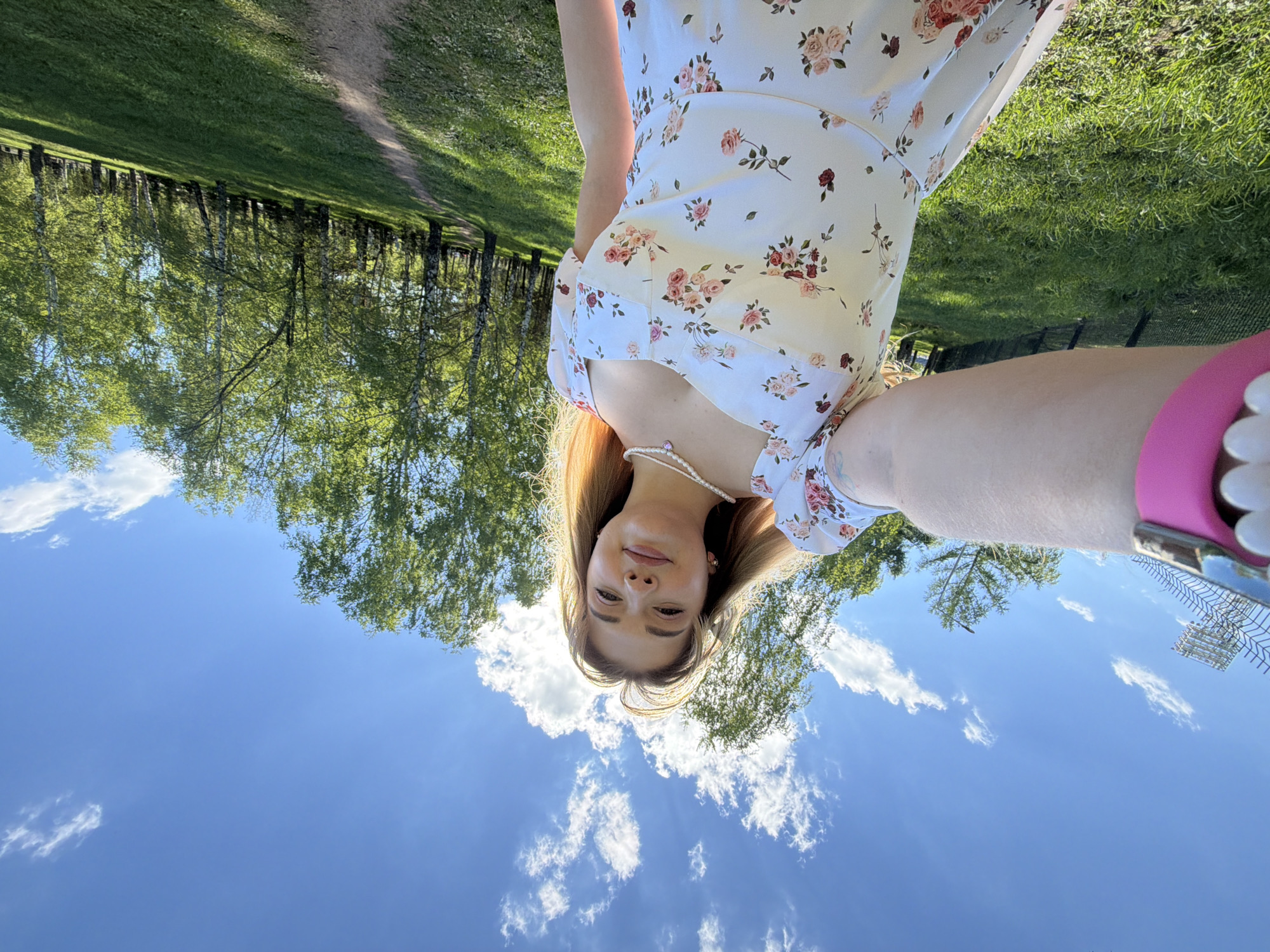 Woman in floral dress photographed outdoors in Naberezhnye Chelny
