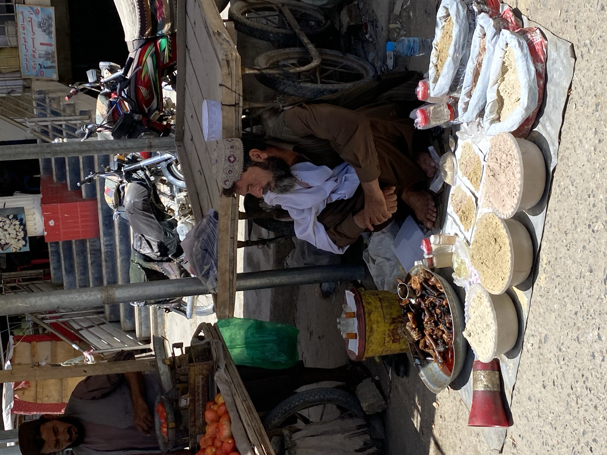 Street market activity near Kandahar's Great Mosque