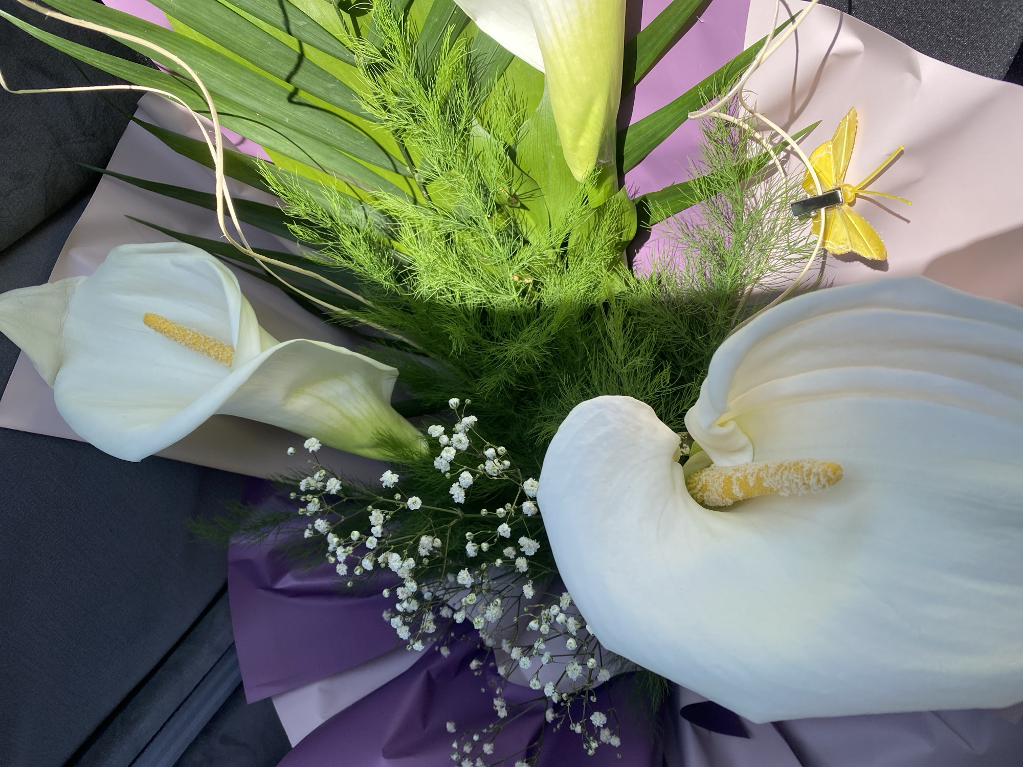 White calla lily bouquet with butterfly decoration spotted in Varna