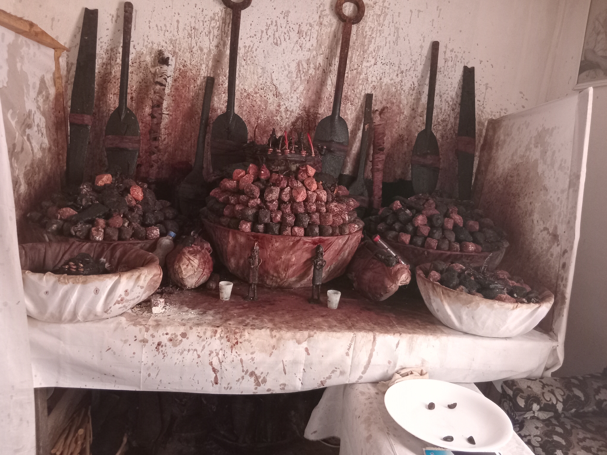 Children play amid traditional shrine elements in Shagamu, Nigeria