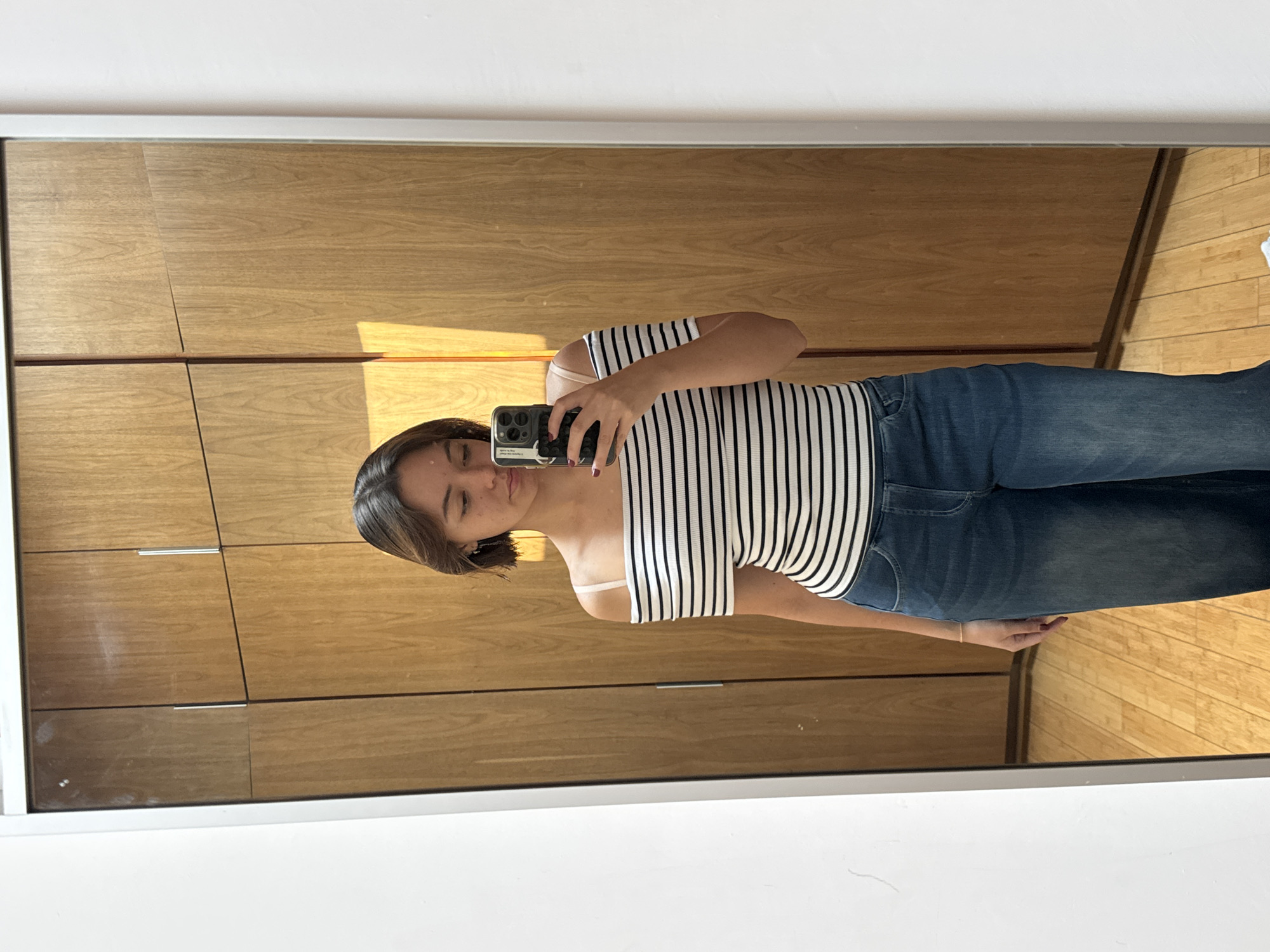 Woman takes mirror selfie at Mexico residence