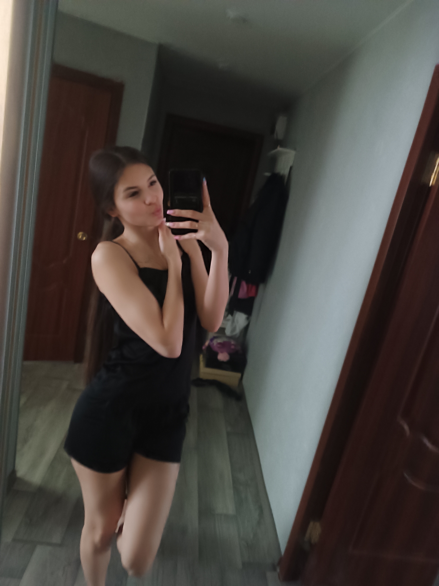Woman Takes Casual Selfies During Morning Indoor Photo Session