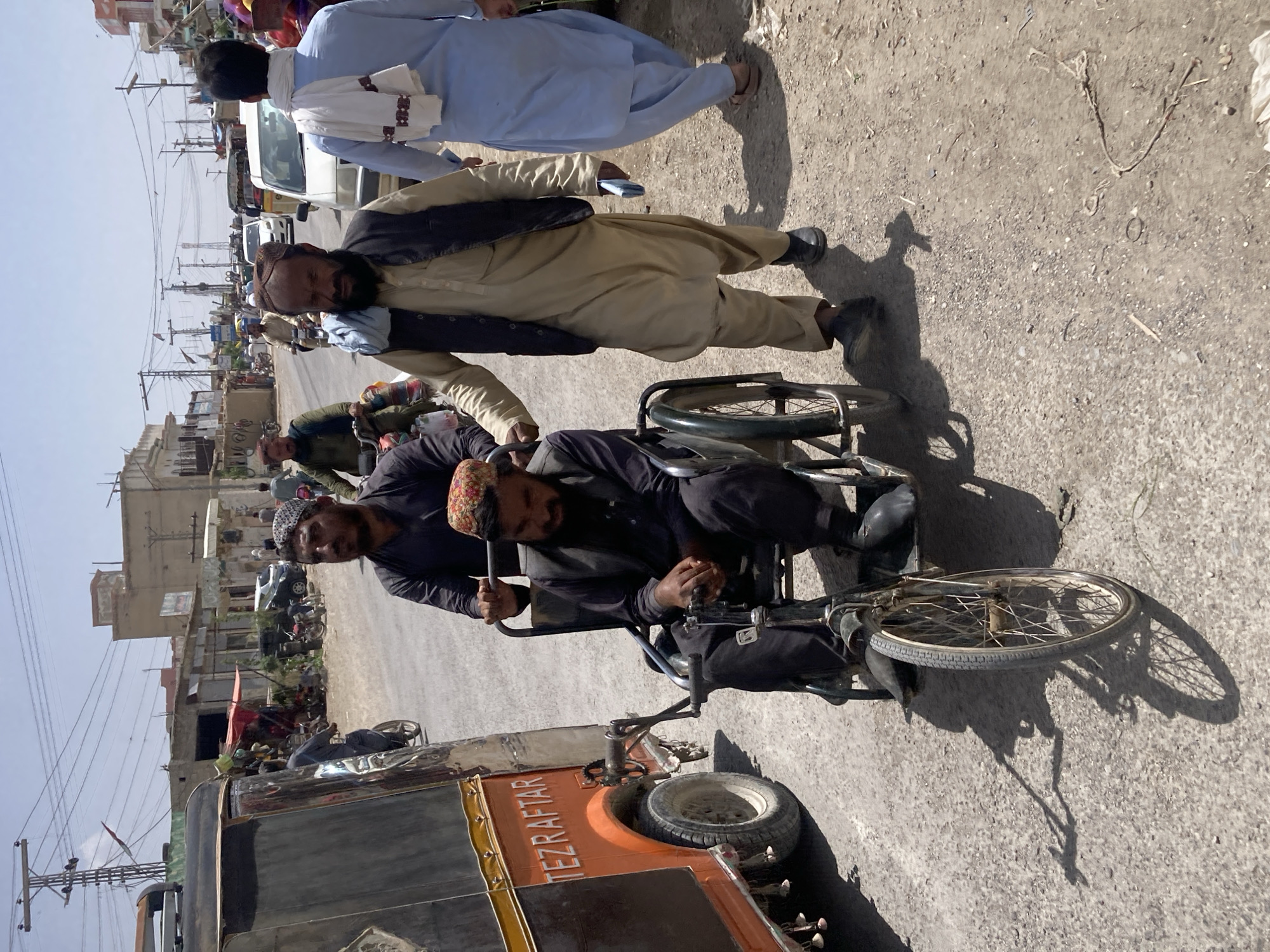 Elderly cyclist spotted on busy Loralai street during sunny afternoon