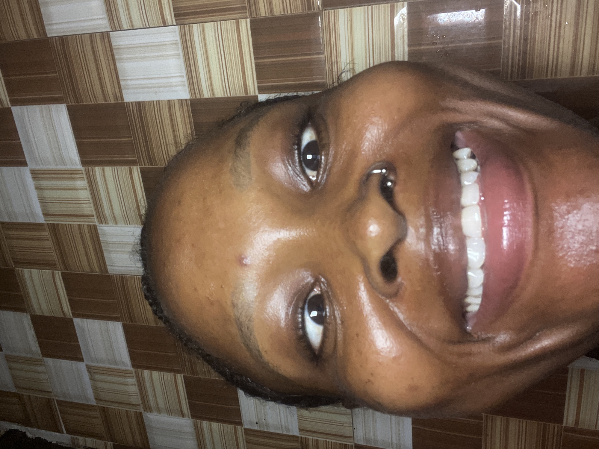 Bathroom selfie session with playful props in Ado, Nigeria