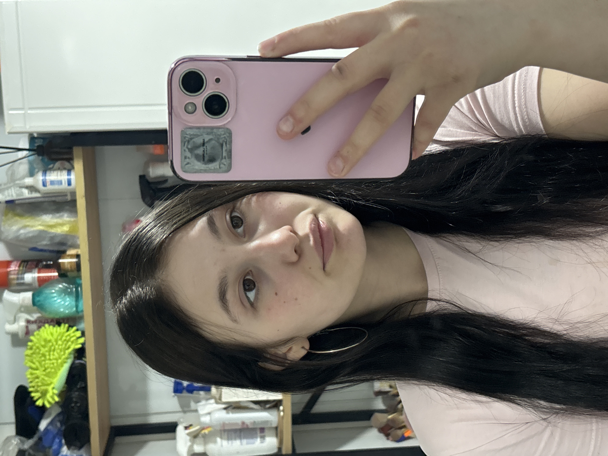 Woman takes playful selfies with cat in Russian home
