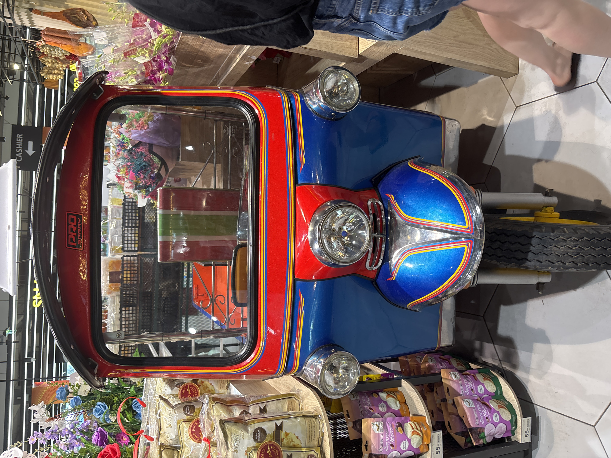 Thai markets display fruits and tuk-tuk in morning hours