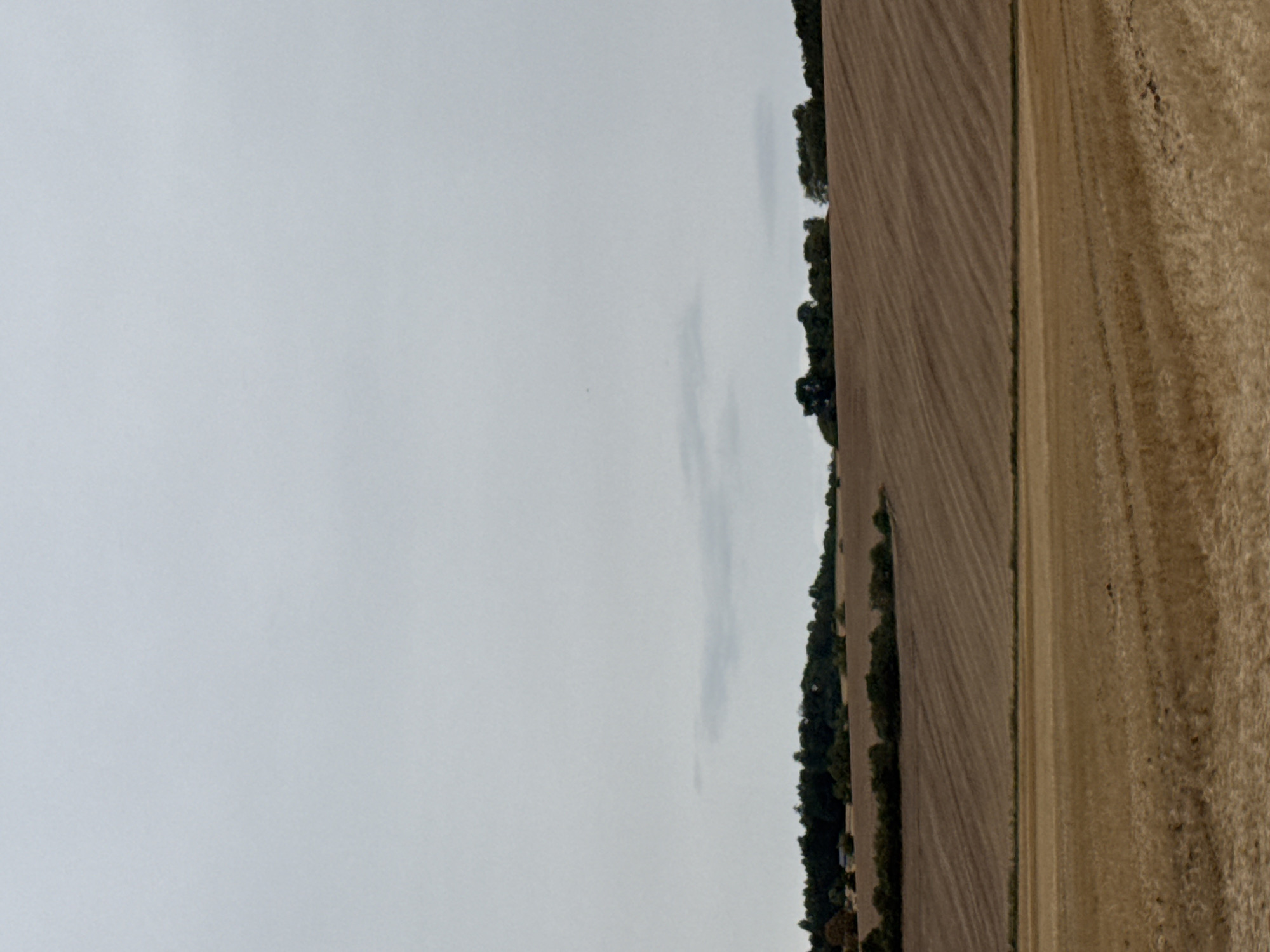 Driving through harvested farmland in Hohenstein on a grey afternoon