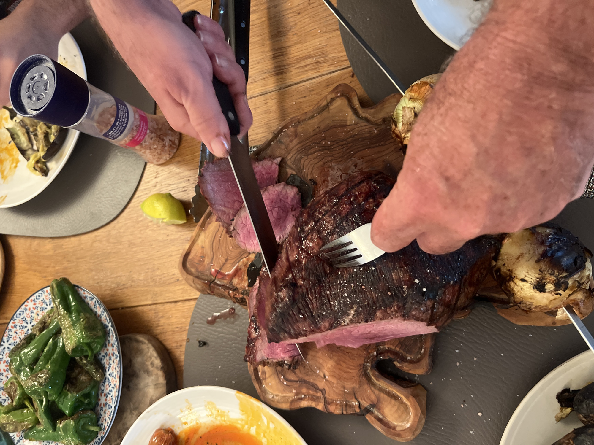 Dinner gathering with meat carving captured in Petah Tikva