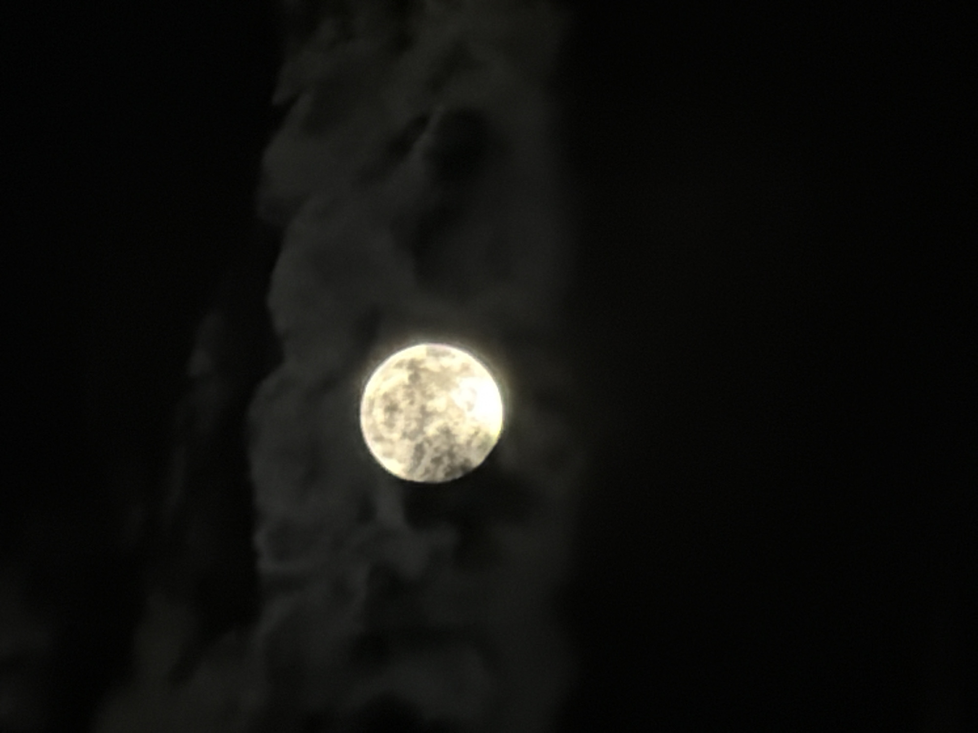 Orange full moon rises over Leudelange on a late July night