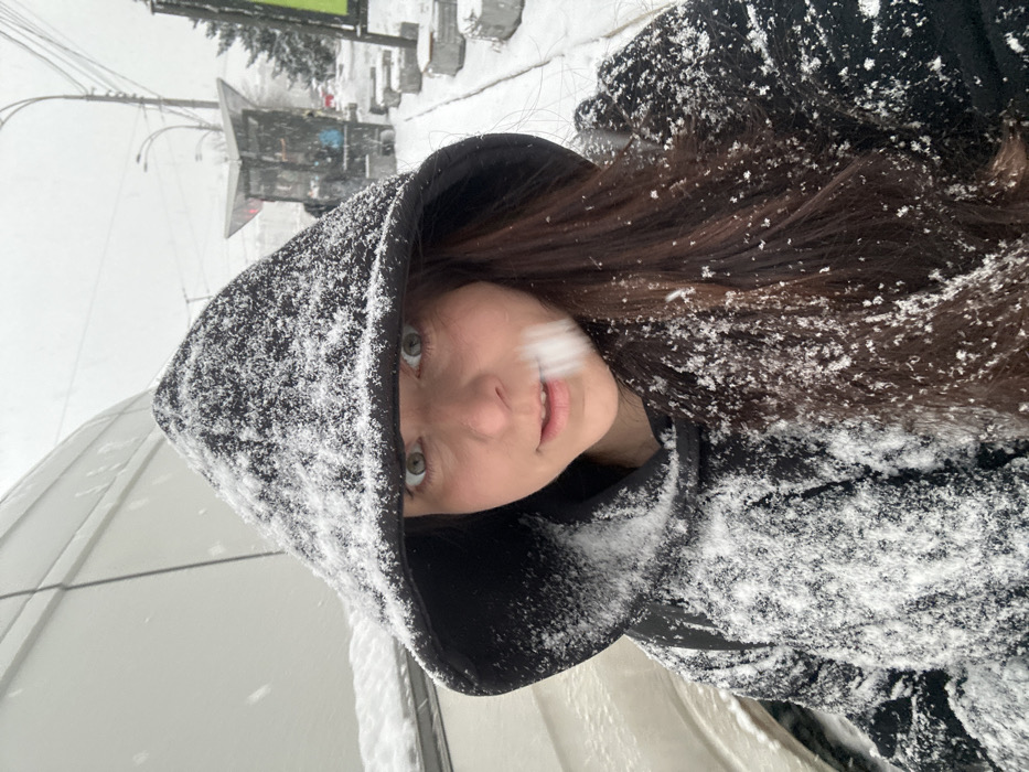 Woman photographed in snowy conditions in Kyiv