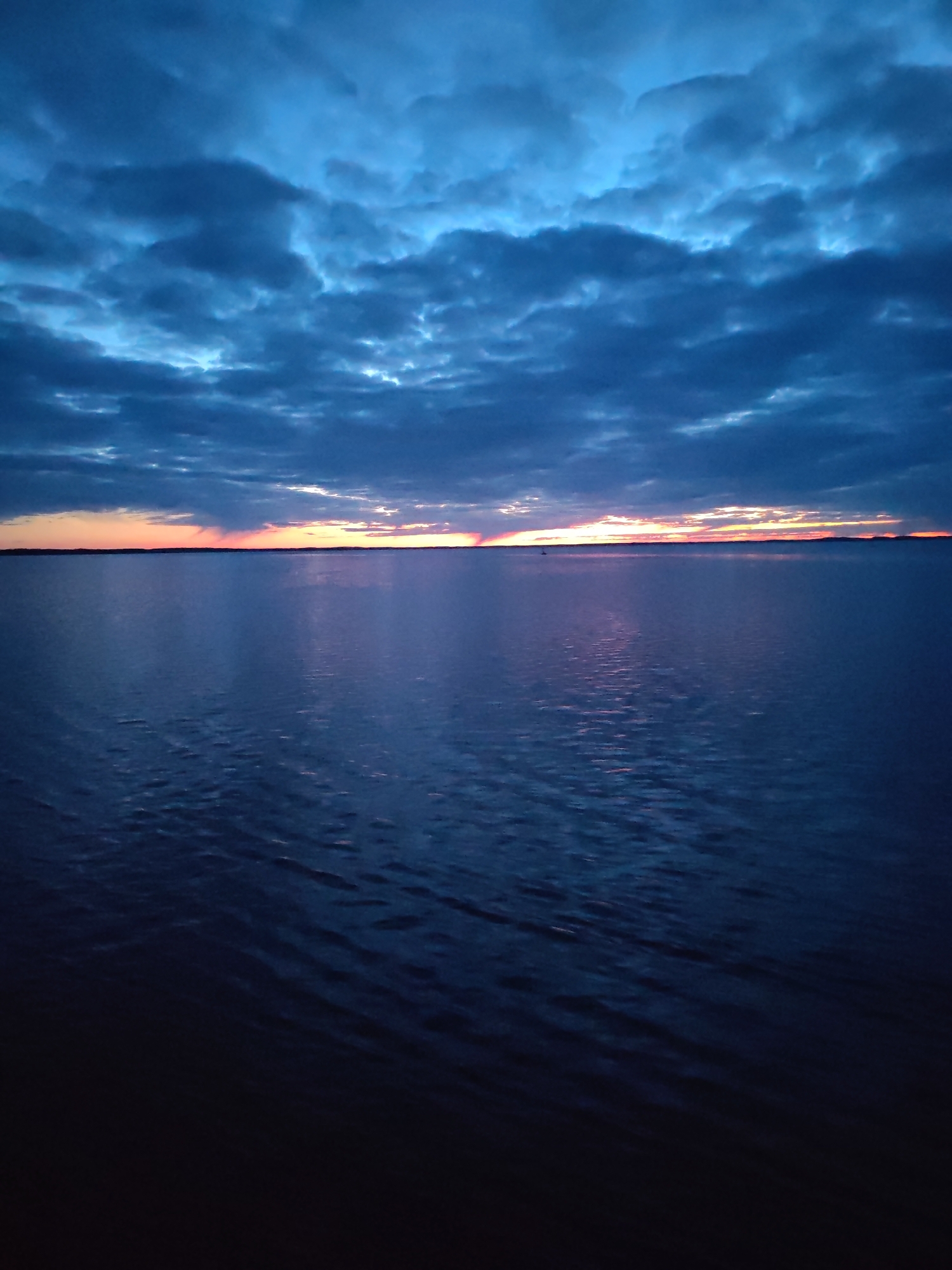 Dramatic dawn sky captured over Russian waterscape May 1