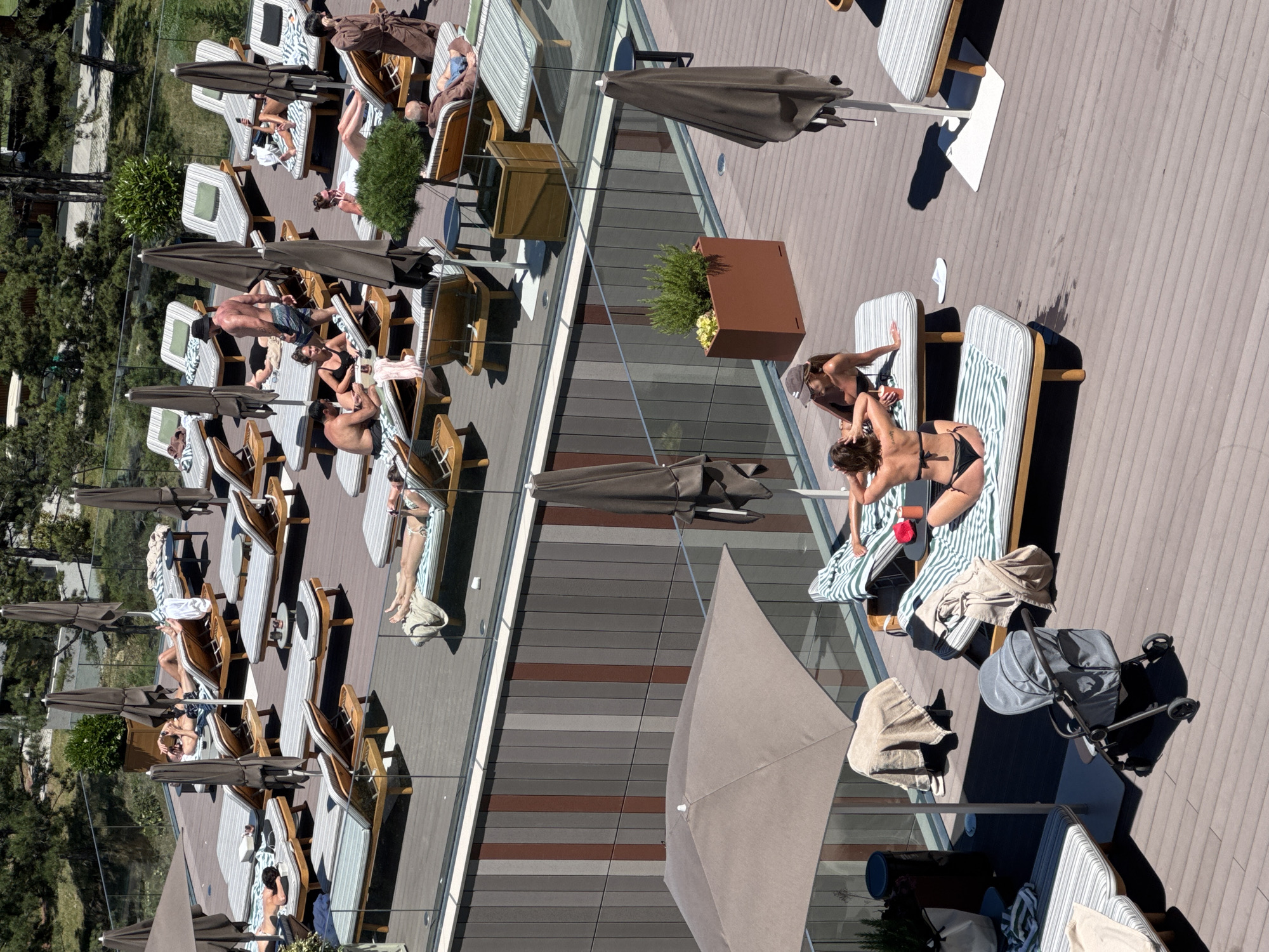 Rooftop pool day above Tbilisi, city and mountains in view