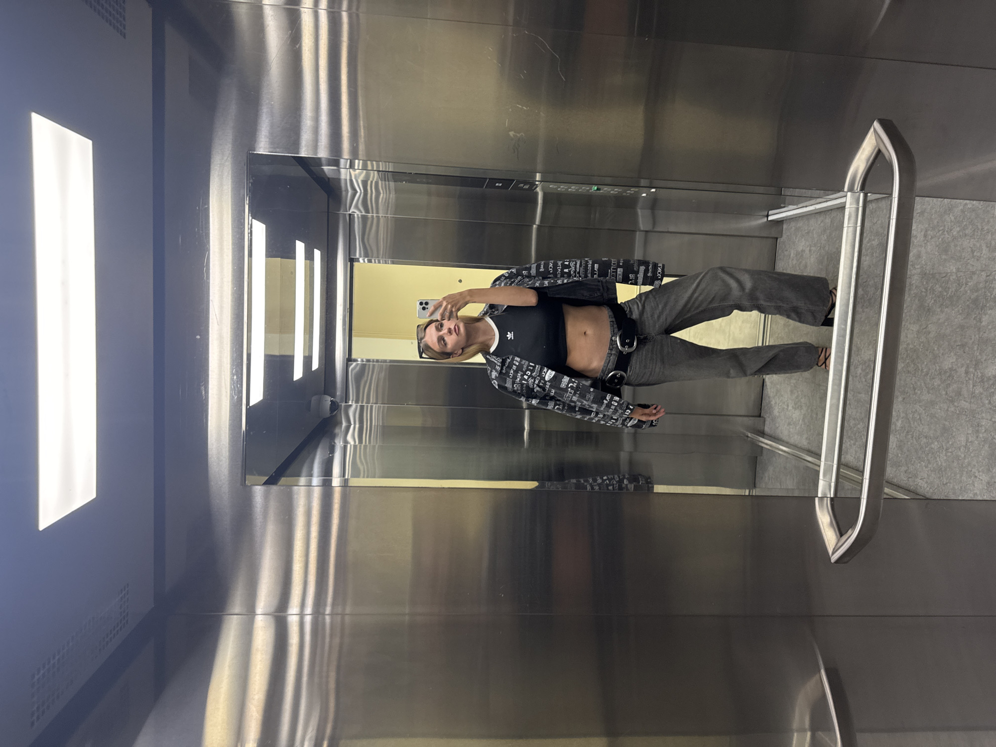 Woman documents morning routine through elevator and car selfies