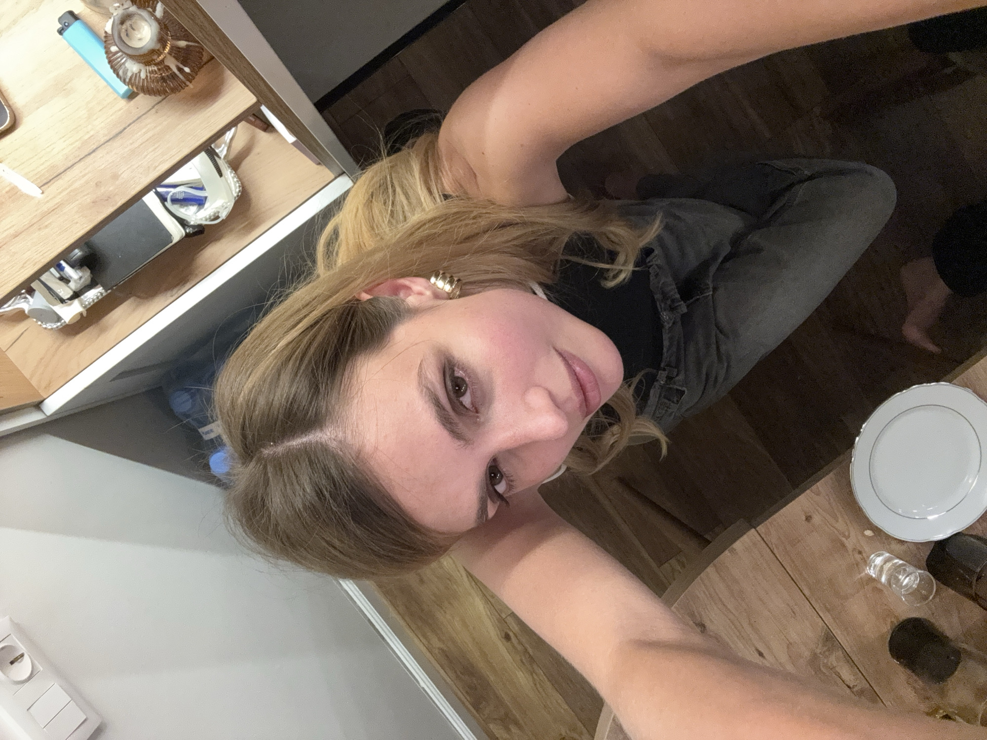 Woman takes selfie in residential setting