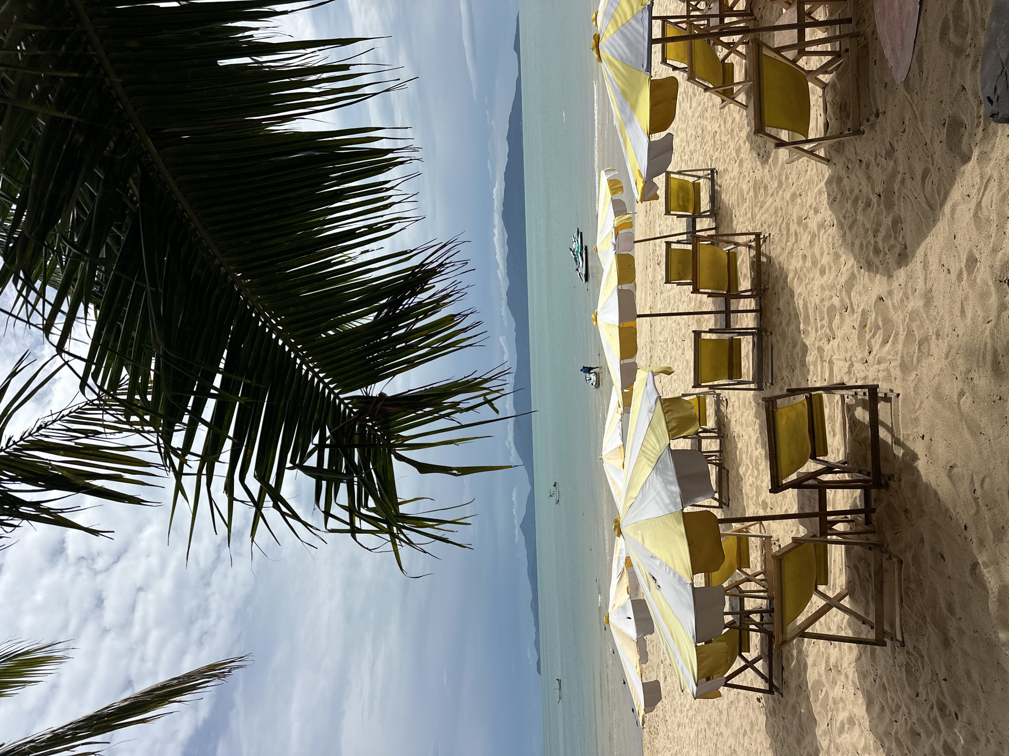 Rows of empty beach chairs on a quiet Ko Samui shore
