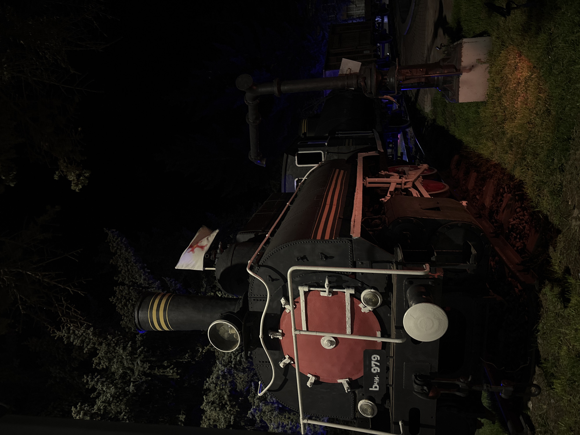 Night visitors photograph historic steam locomotive display in Gyumri