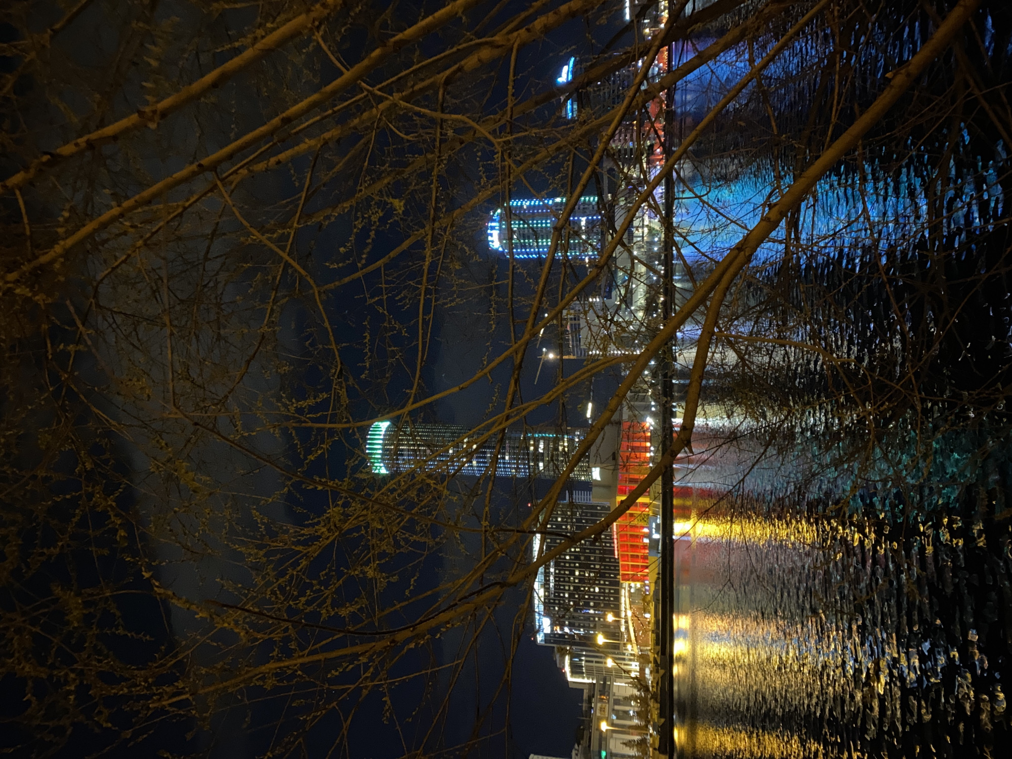 Nighttime photography session documents Yekaterinburg waterfront reflections