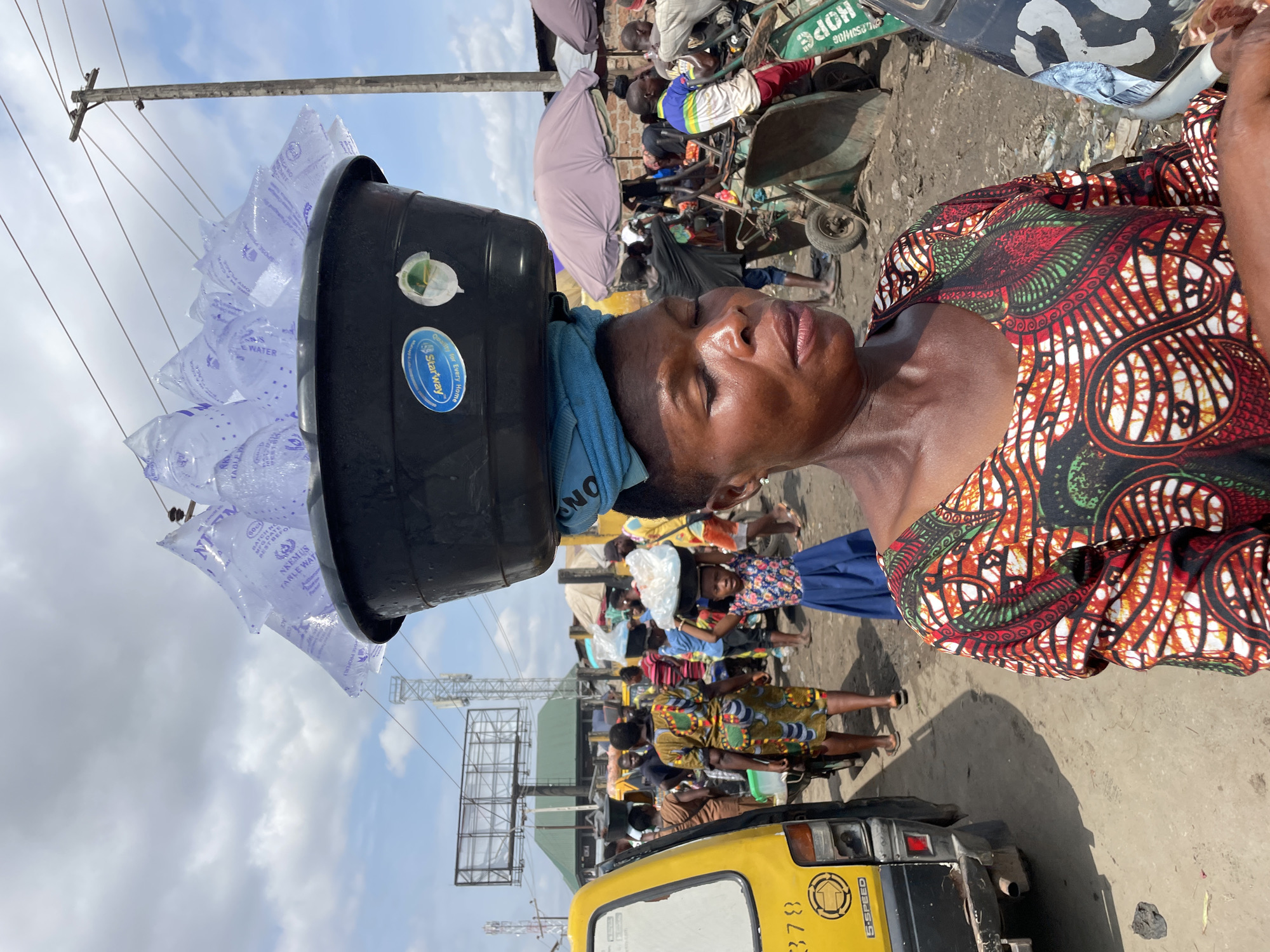 Street vendors and foot traffic in Onitsha's busy market district