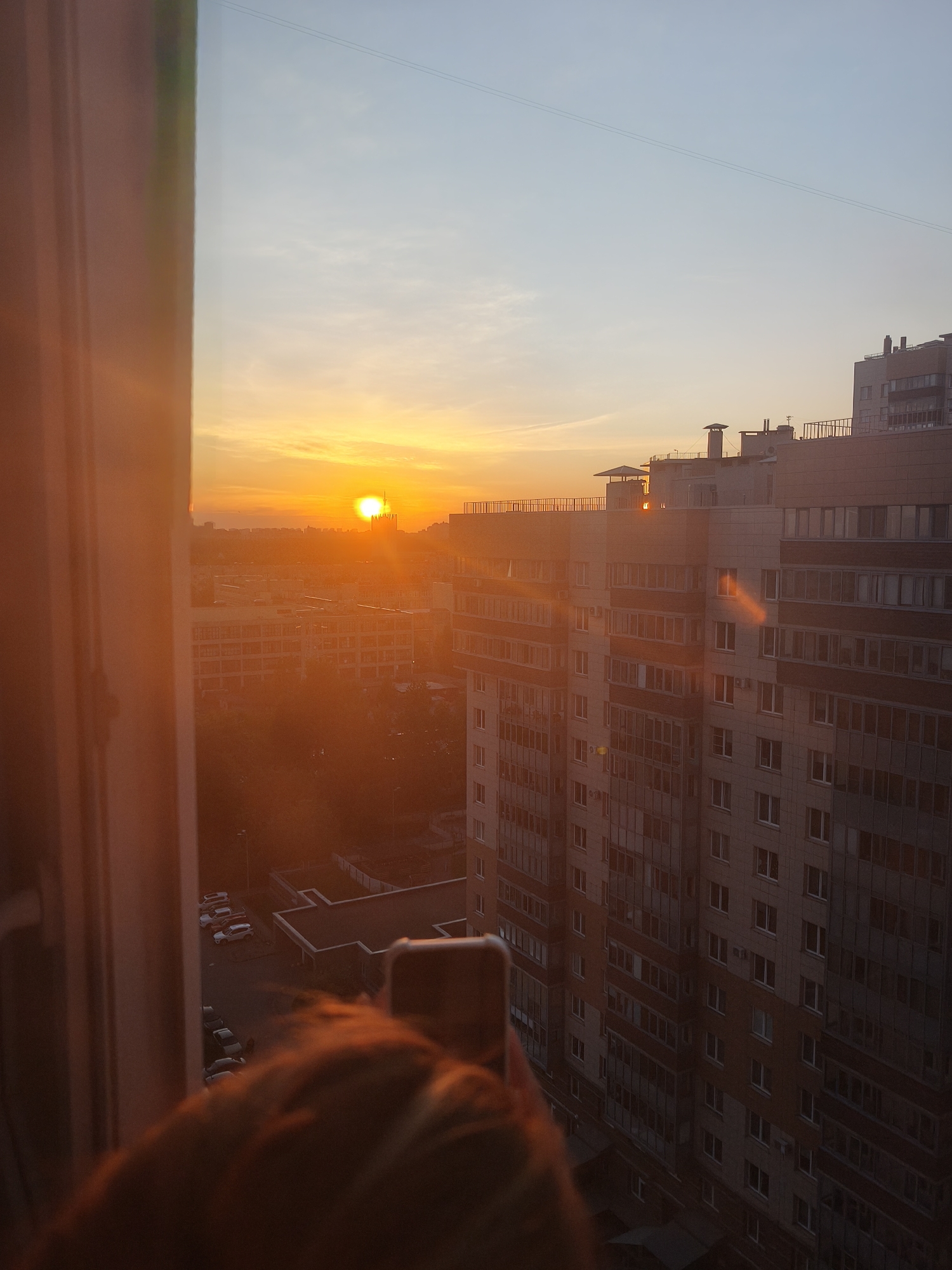 Sunset observed over city skyline from elevated position