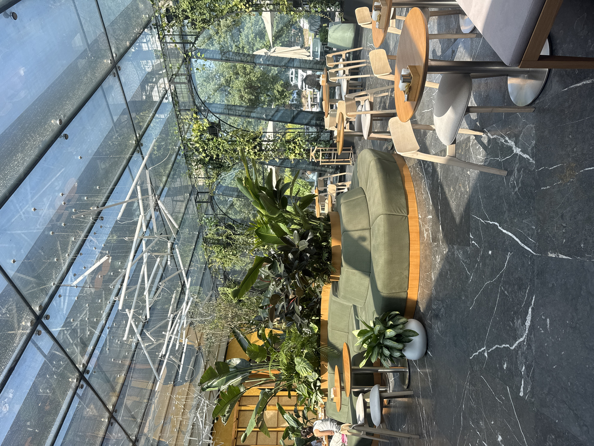 Morning coffee stop at a plant-filled glass-ceiling café in Almaty