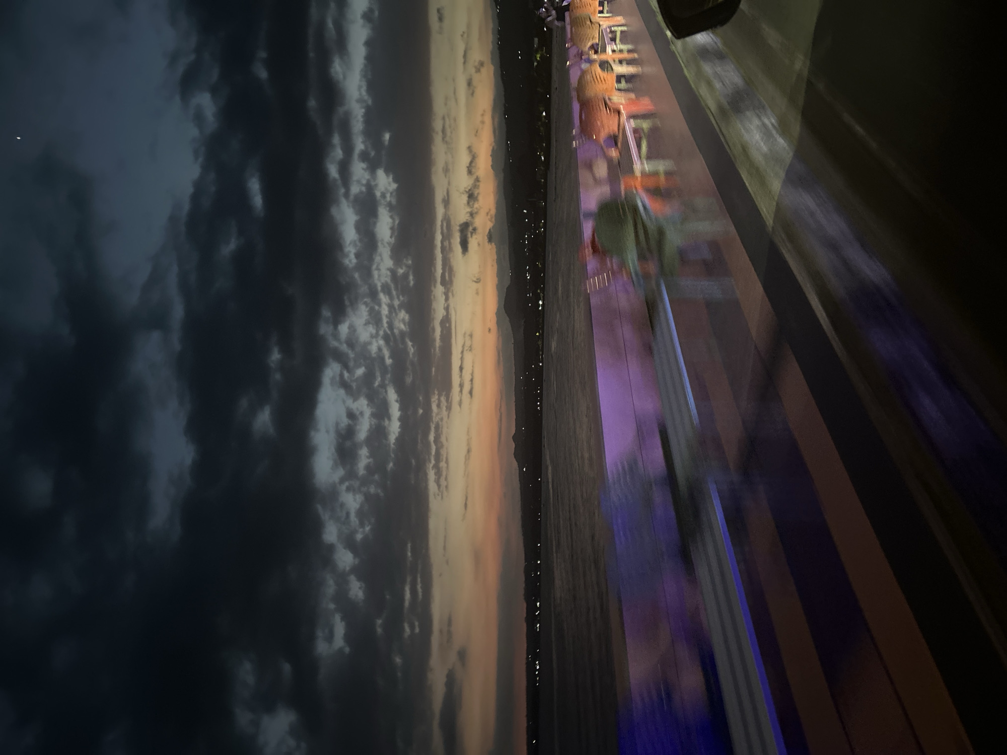 Dusk settles over Bantaeng's waterfront, streets, and stalls