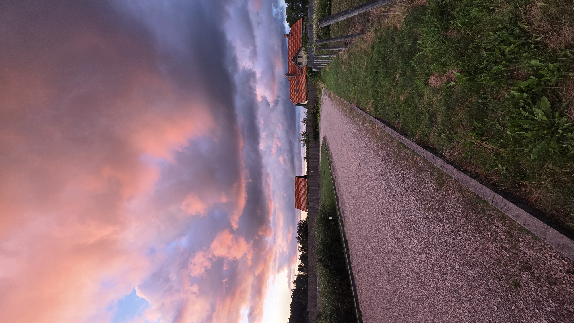 Dramatic summer sunset over a rural lakeside in Jaunmārupe, Latvia