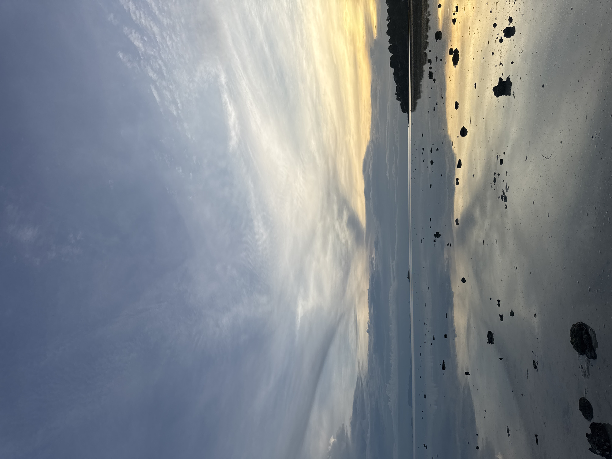 Low tide walk on Koh Phangan's reflective tidal flats