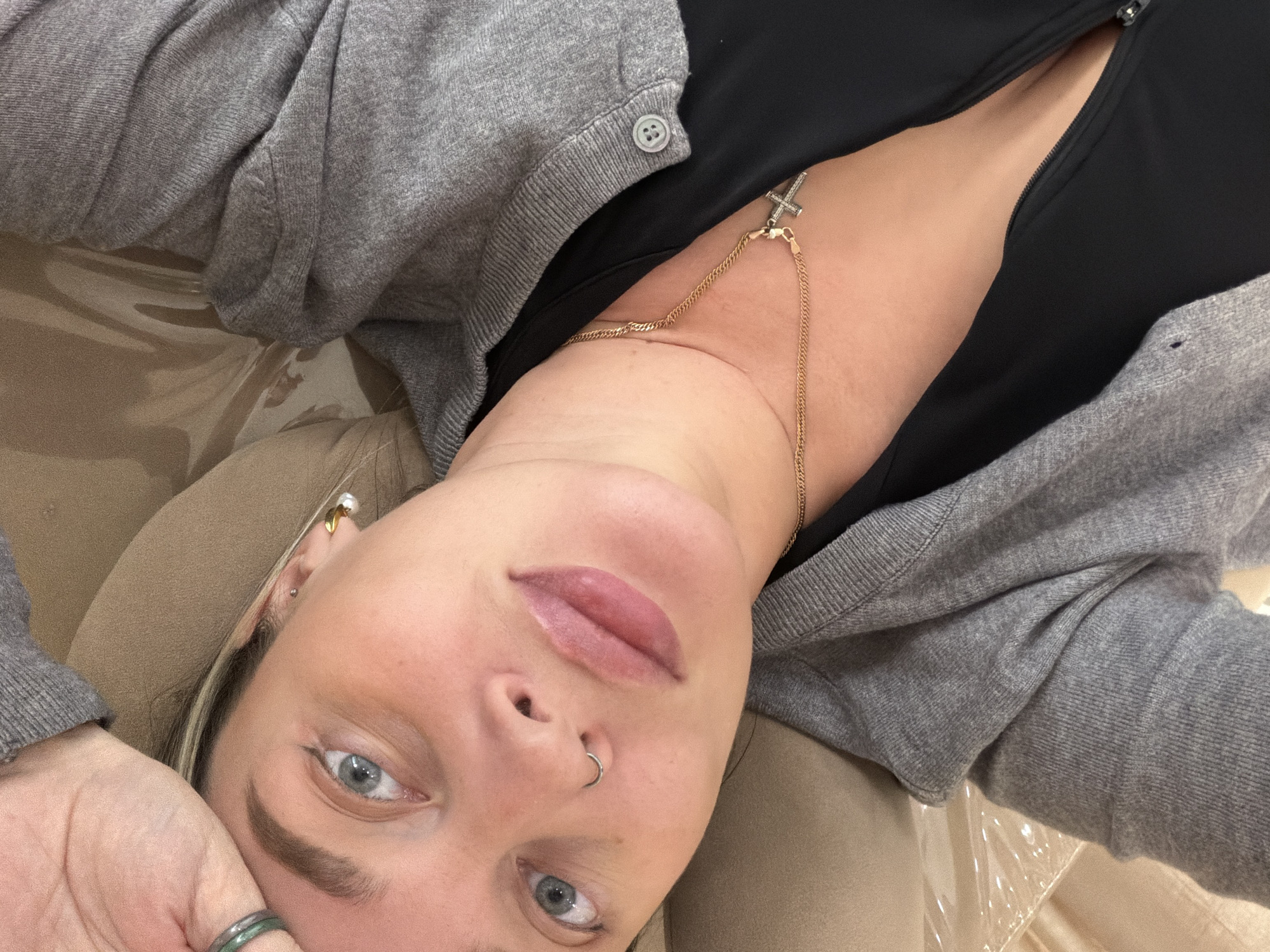 Person with cross necklace observed resting in Khimki
