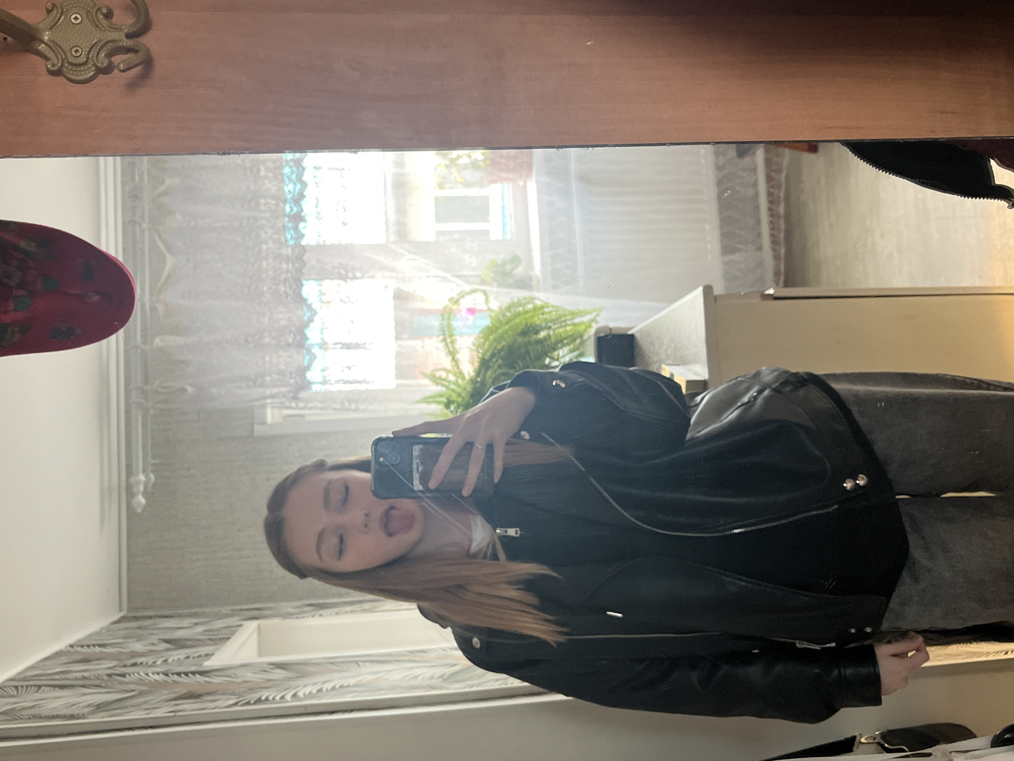 Woman takes casual selfies and photos in Chaikovsky home