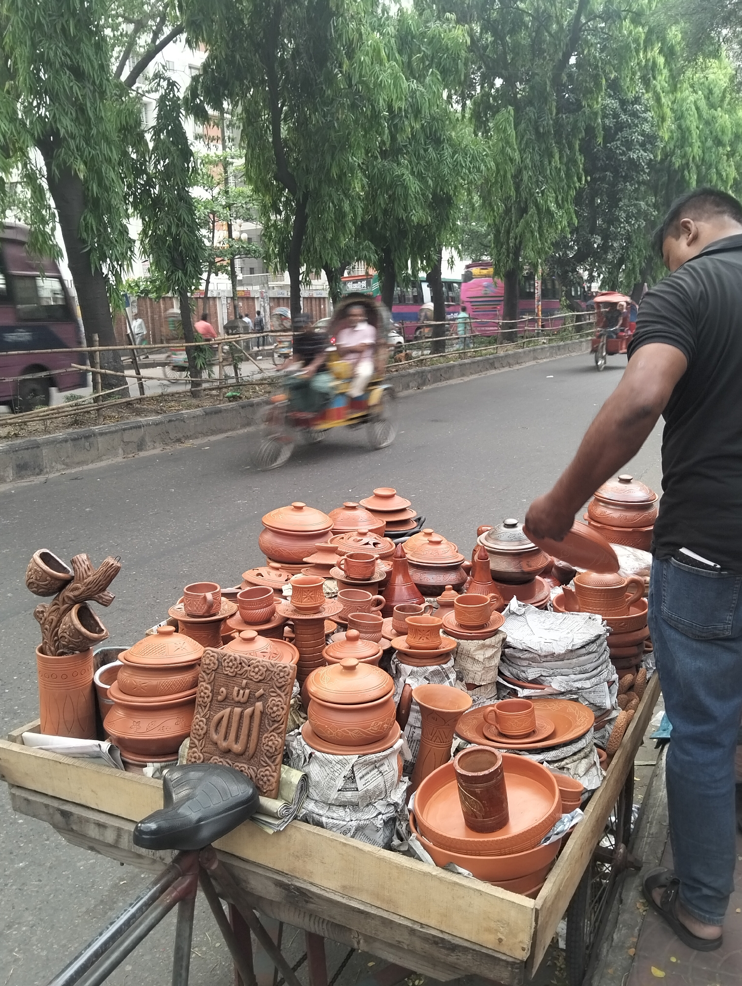 Street vendors operate during busy morning in Dhaka