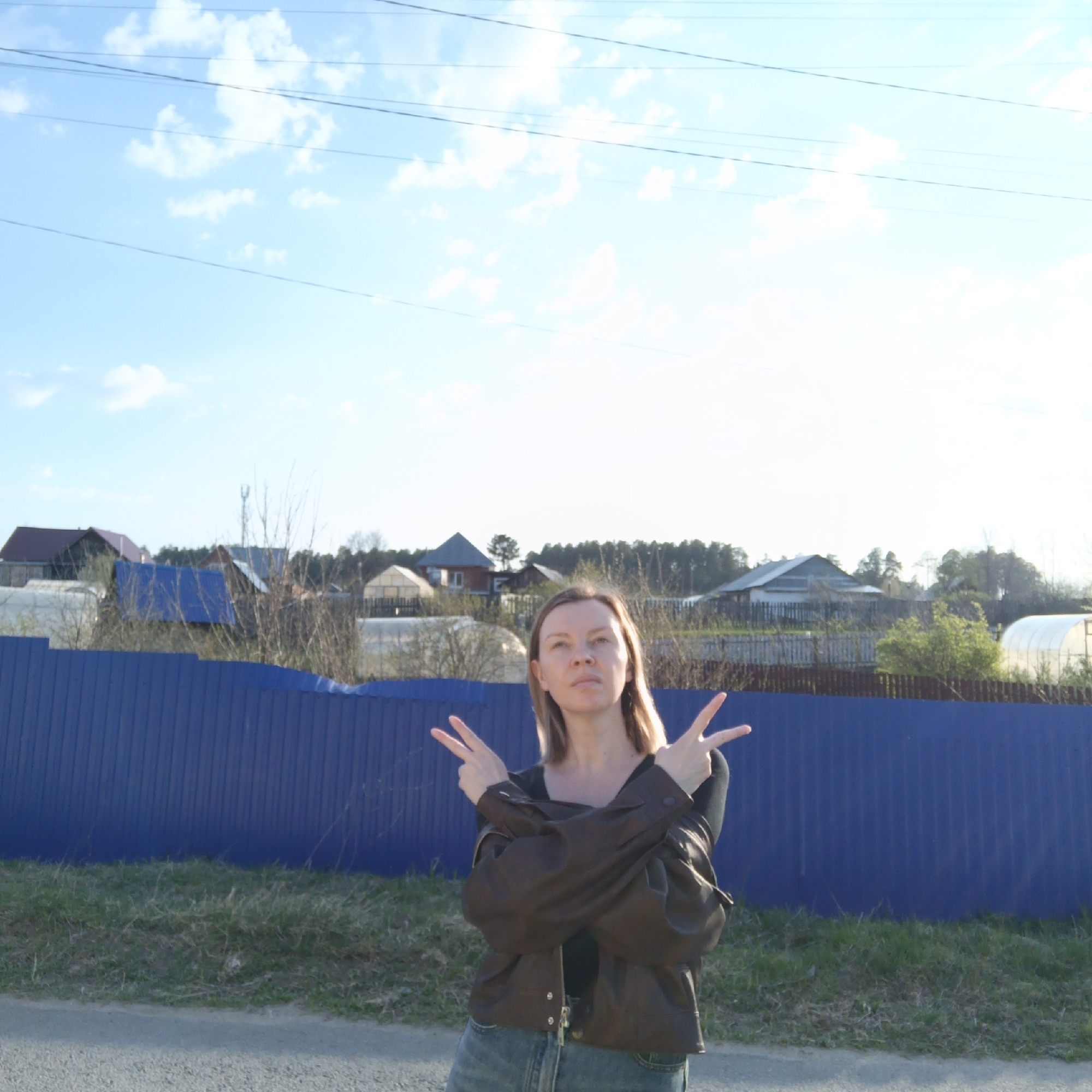 Woman photographed with dog in rural Chaikovsky, Russia