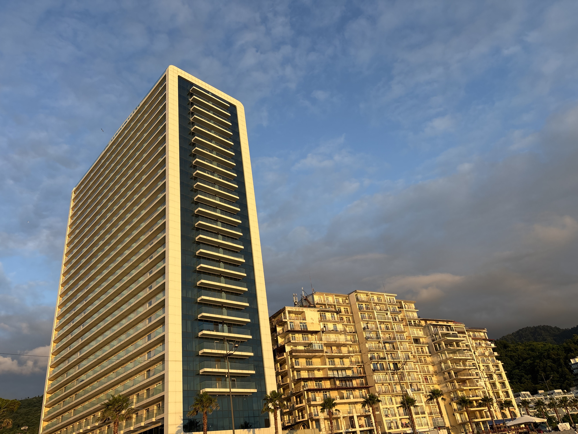 Golden hour on Batumi's pebble beach along the Black Sea