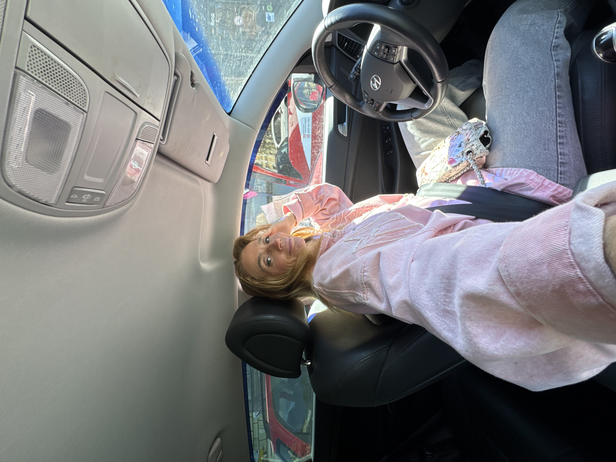 Woman sits in Hyundai during heavy traffic in Saint Petersburg