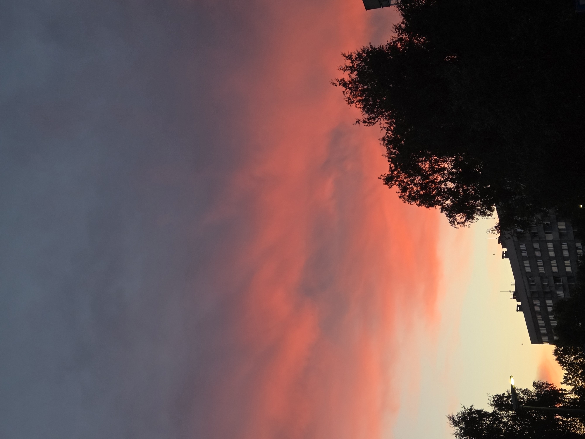 Szczecin skyline in silhouette under a colorful summer sunset