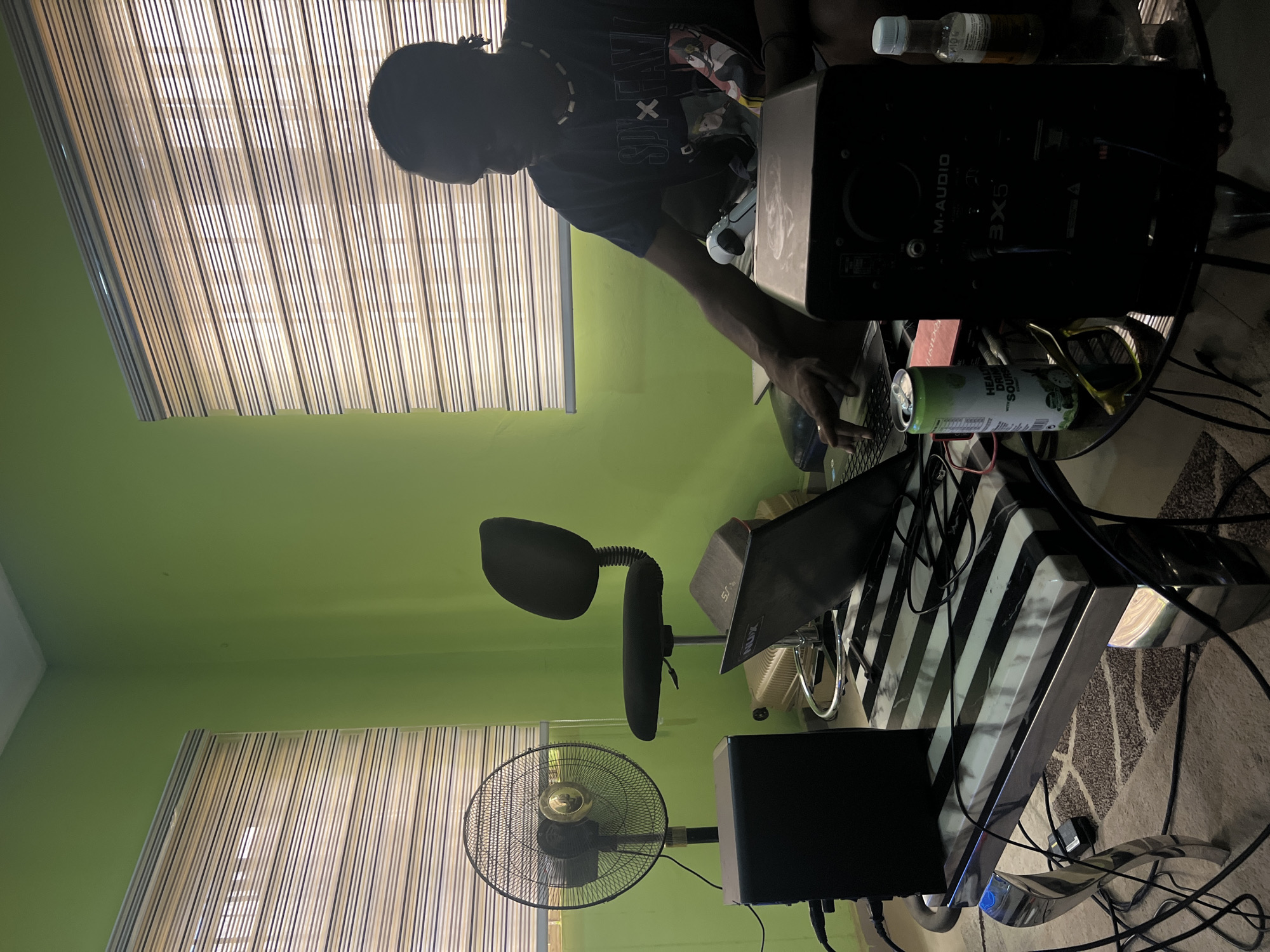 Music producer records in home studio in Abuja