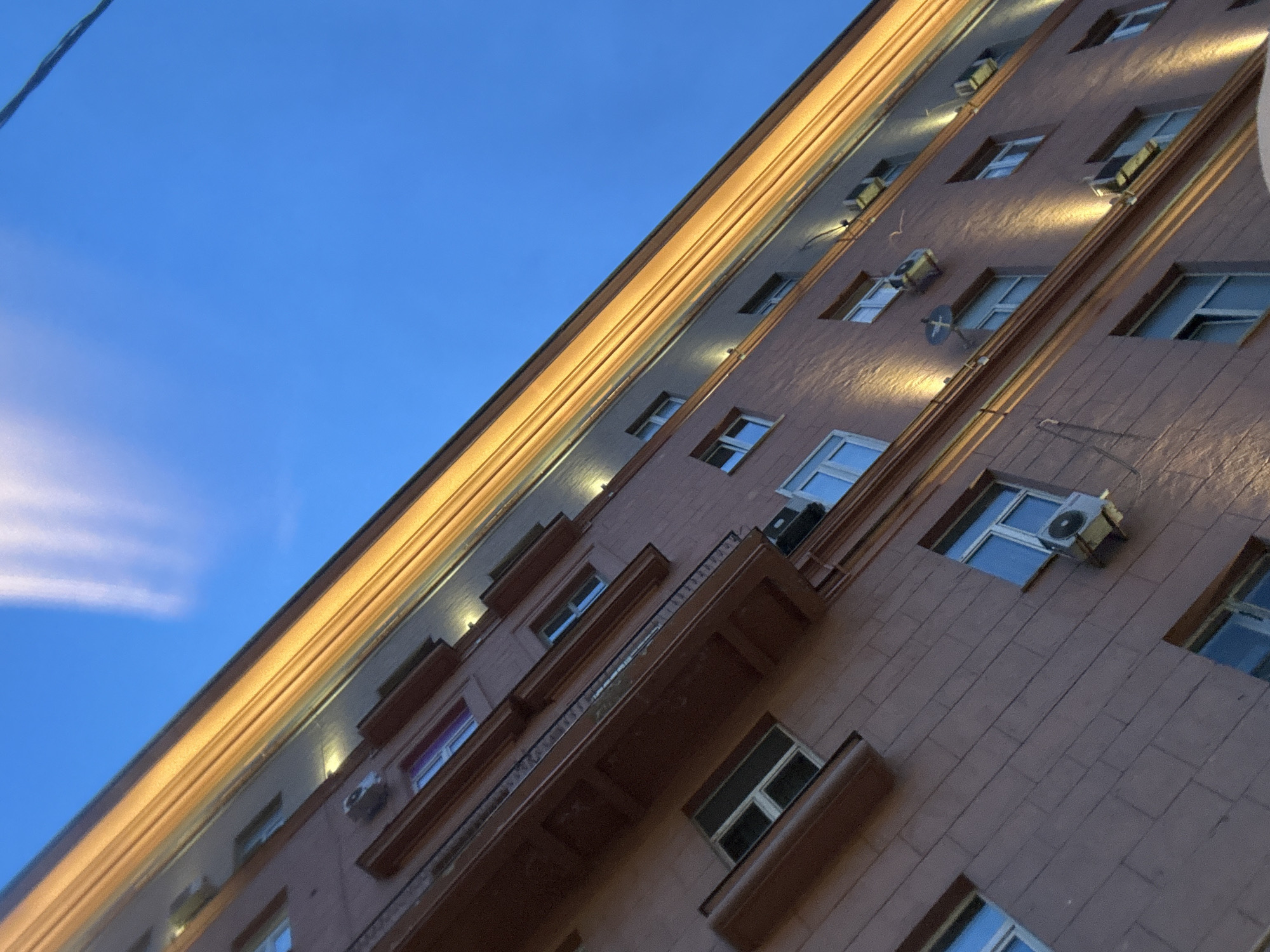 Evening urban documentation captures wet streets and city landmarks