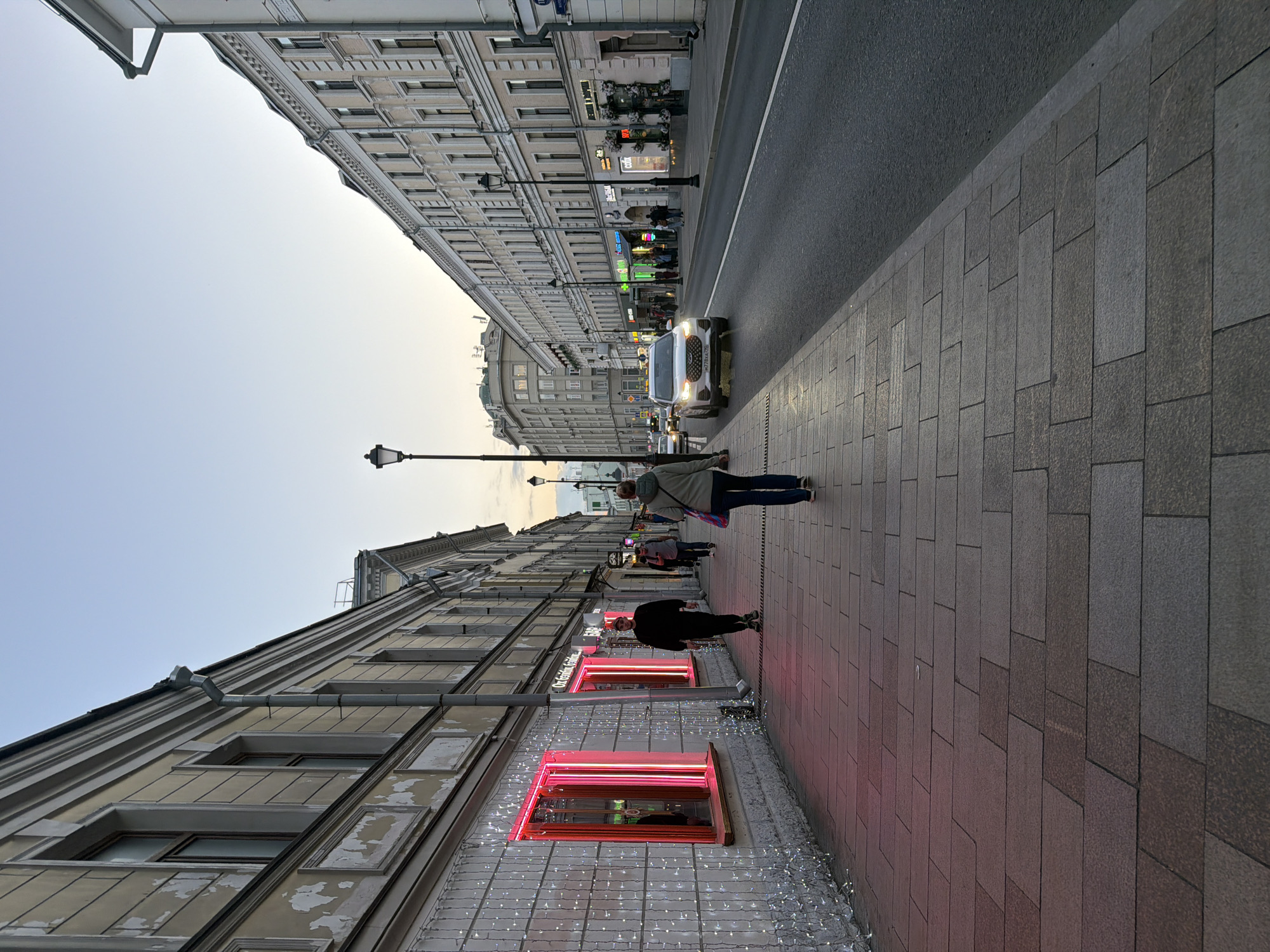 Woman takes selfies in decorative street mirror in Moscow