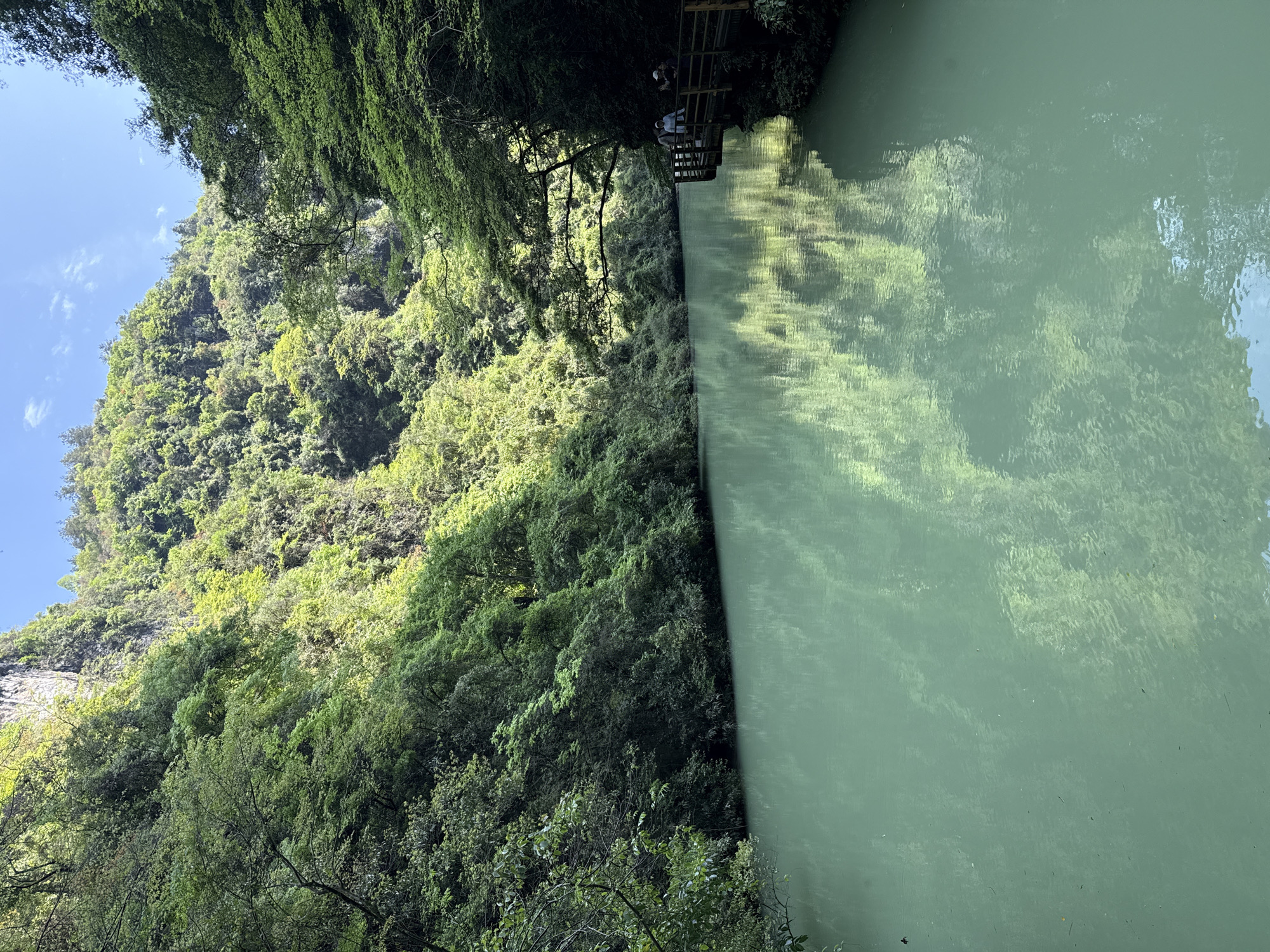 Green landscape with milky water documented in Zhangjiajie, China