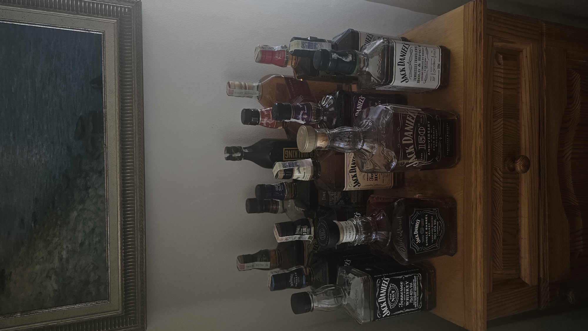 Whiskey collection displayed on wooden furniture in Bulgarian town
