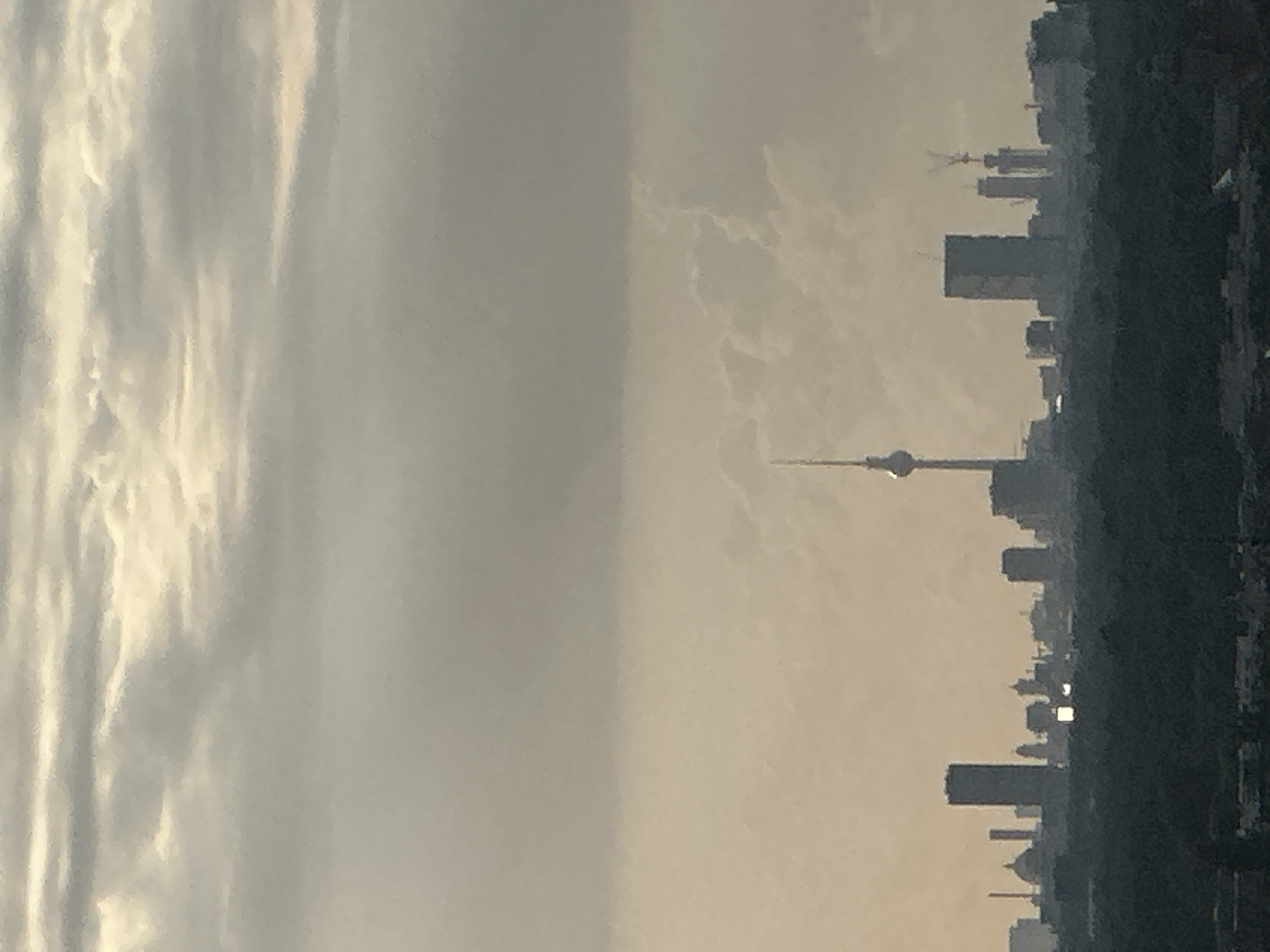 Berlin skyline at sunset, clouds and golden light, July 2026