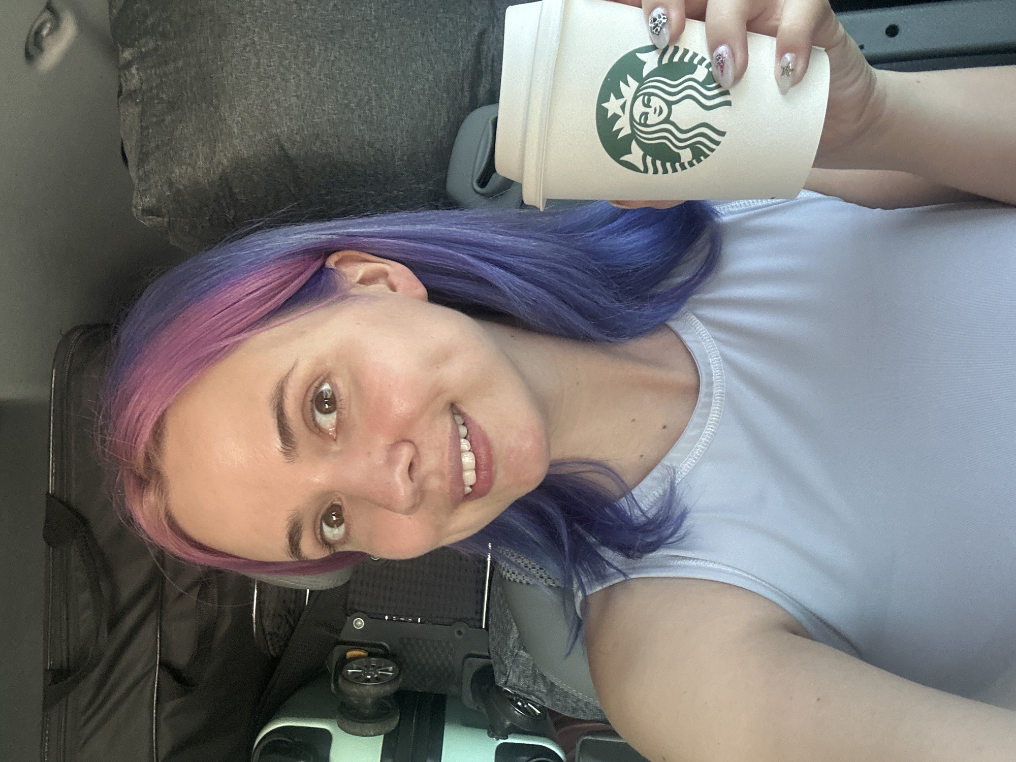 Woman enjoys Starbucks and pizza lunch in Mougins vehicle