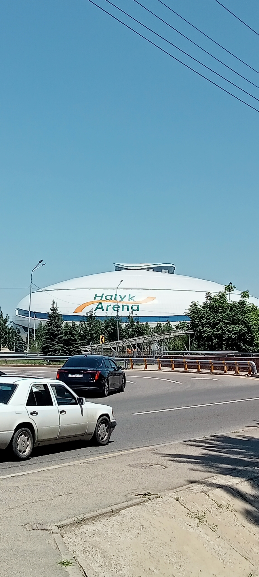 Morning street life around Almaty's Abu Hanifa Mosque and Halyk Arena
