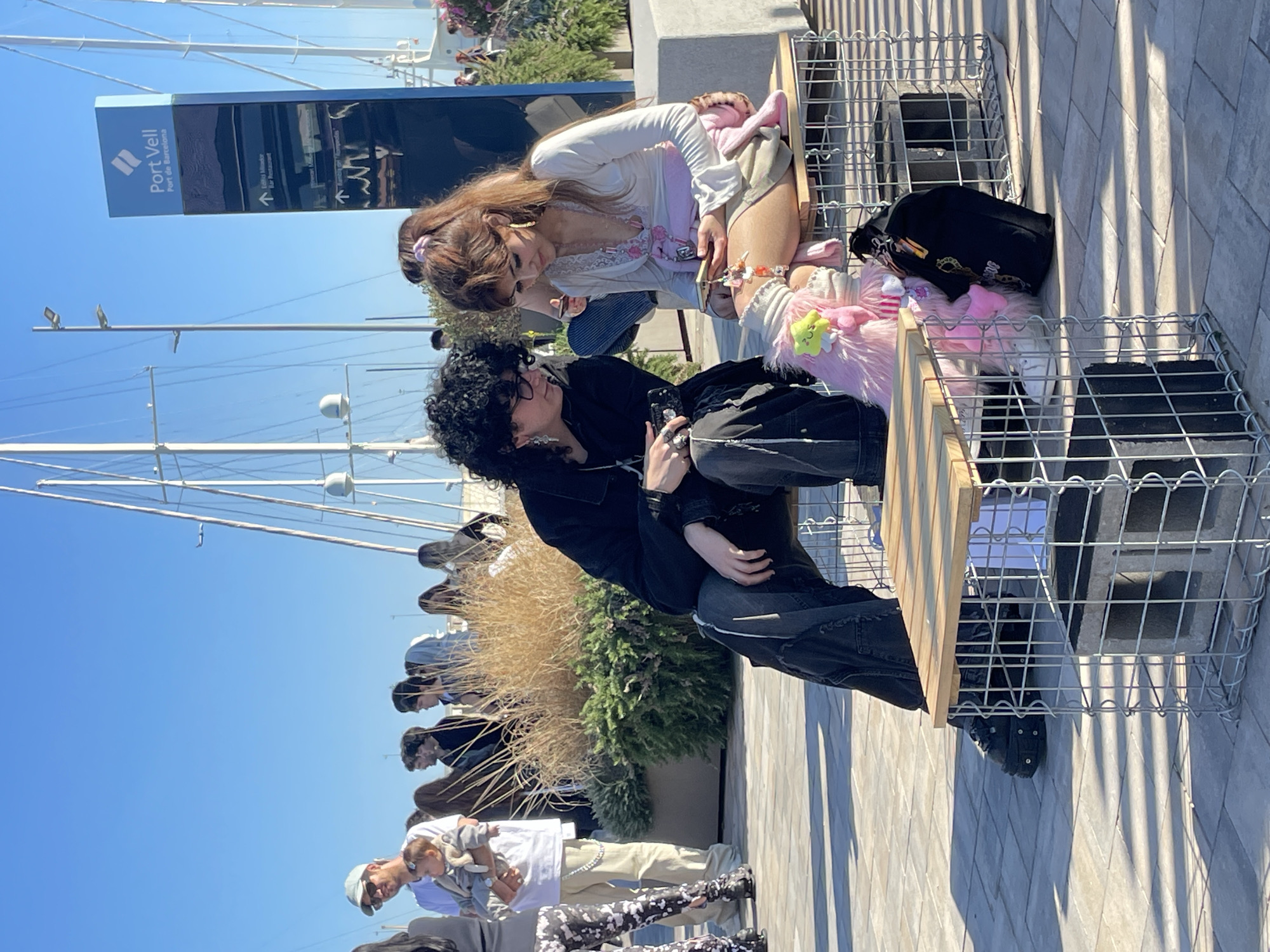 Sunny afternoon brings visitors to Barcelona's Port Vell waterfront