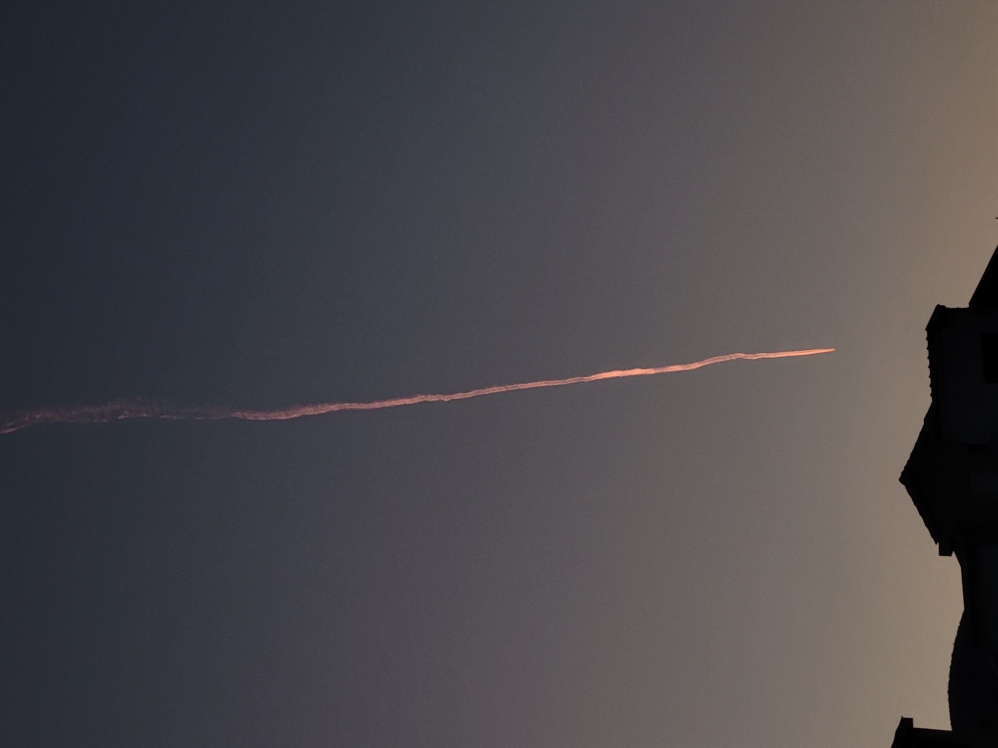 Evening meal and contrail observed in Budva, Montenegro