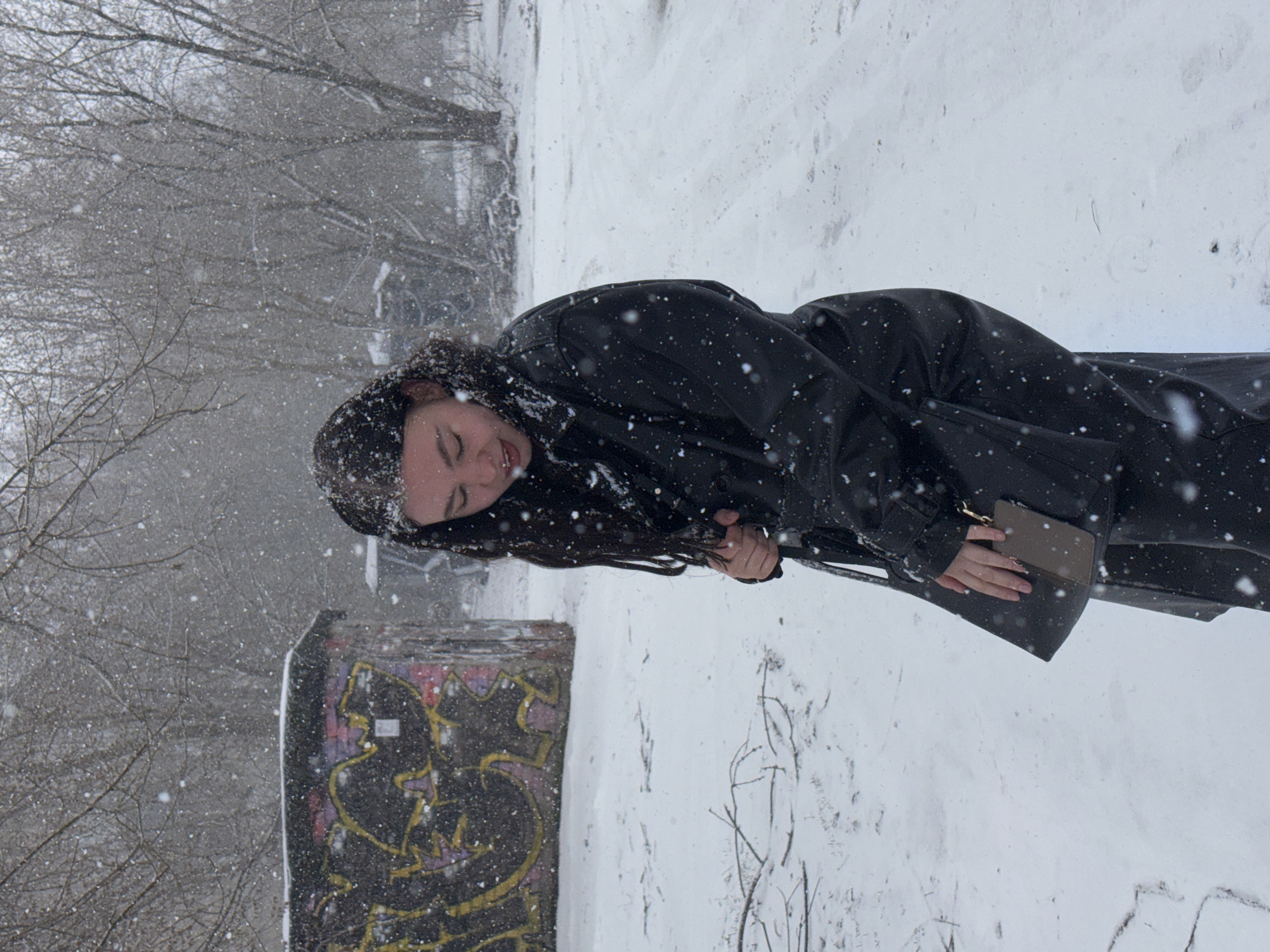 Woman photographed during heavy snowfall in Perm, Russia