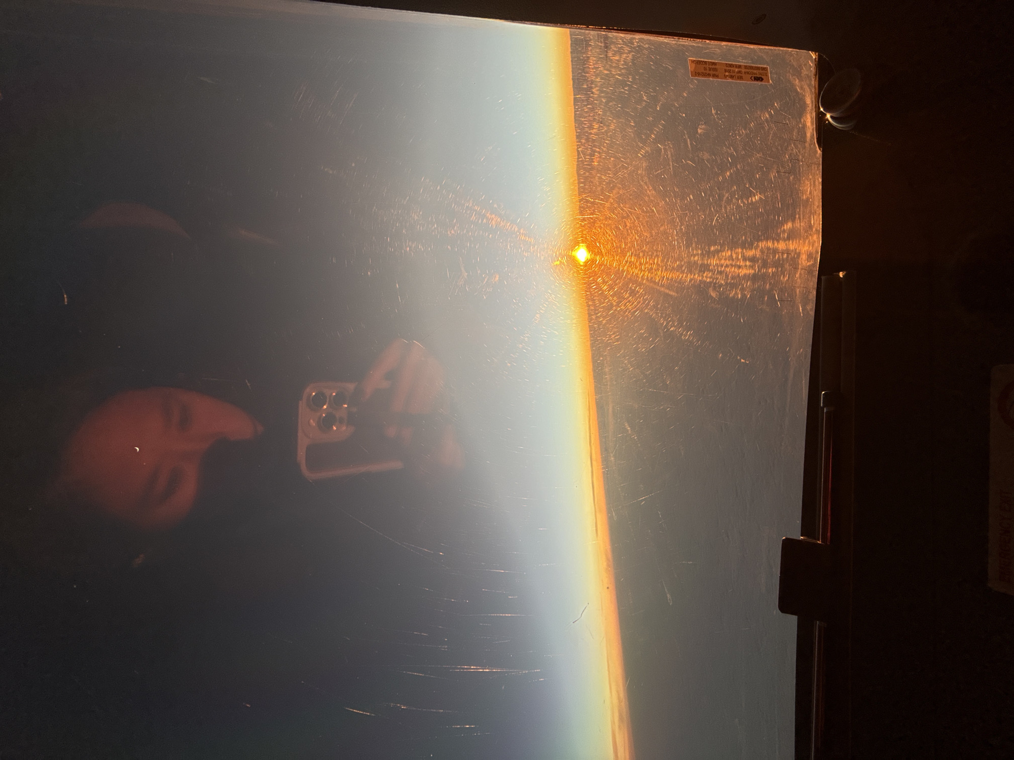 Sunset reflection captured in glass panel in La Serena