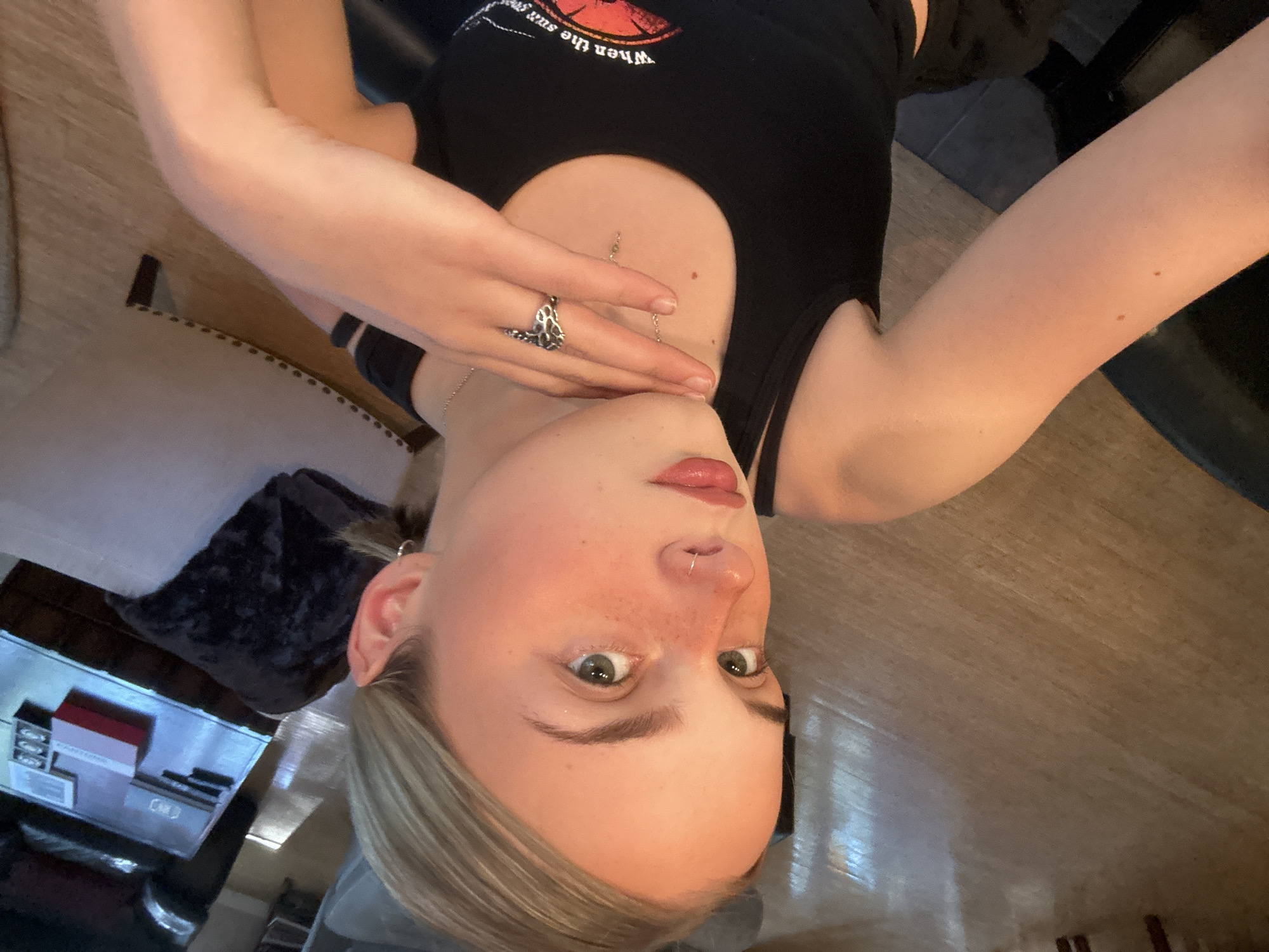 Woman takes upside-down selfie indoors in Whistler