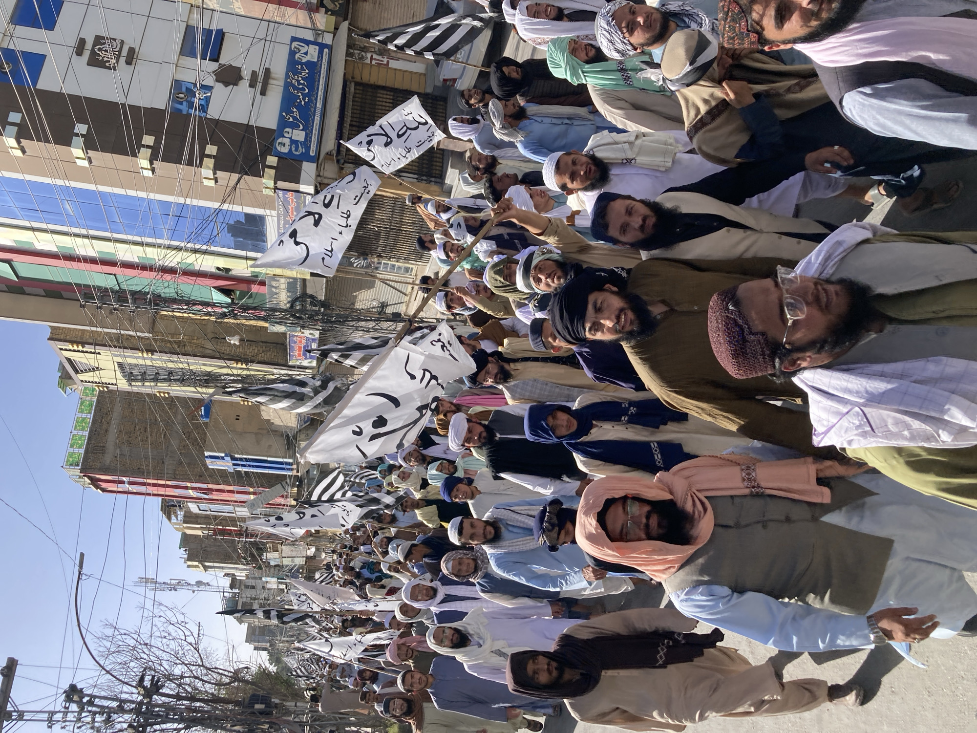 Men march in demonstration through Quetta streets carrying banners
